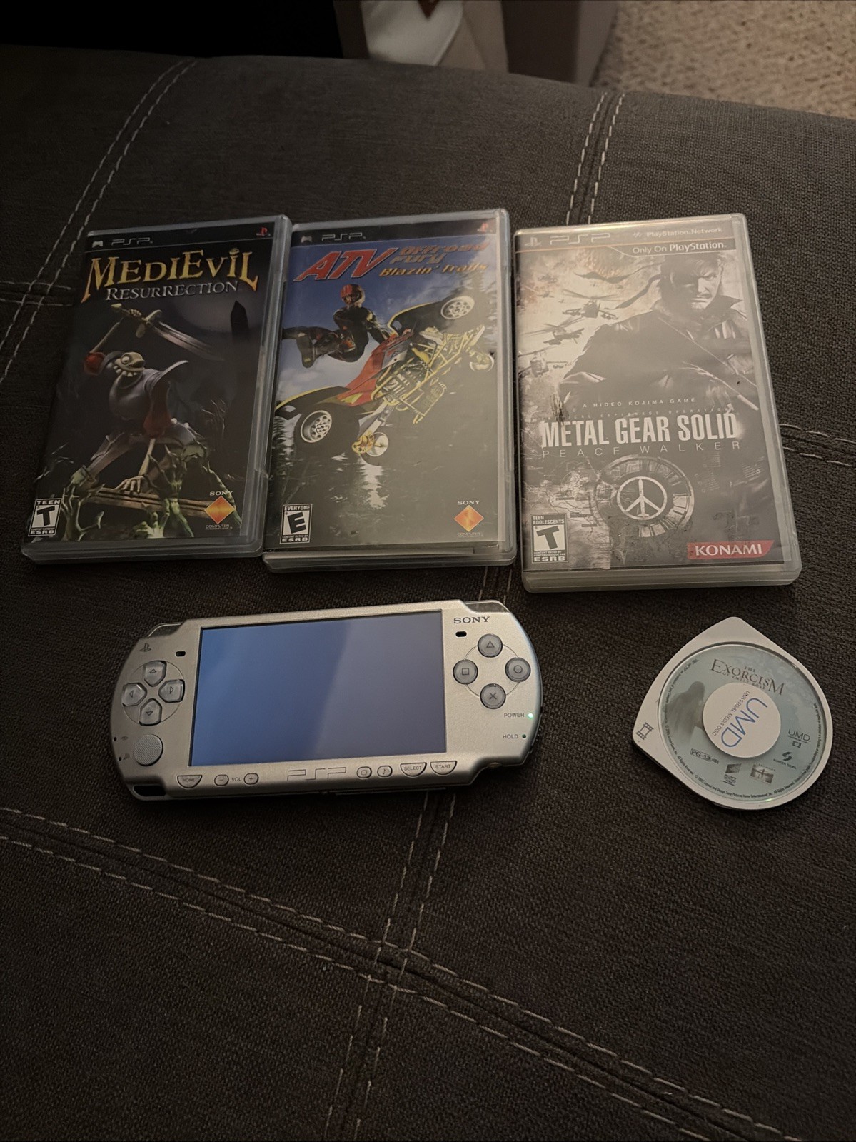 Sony PSP 2001 Handheld Console System Silver with 3 games and 1 movie.