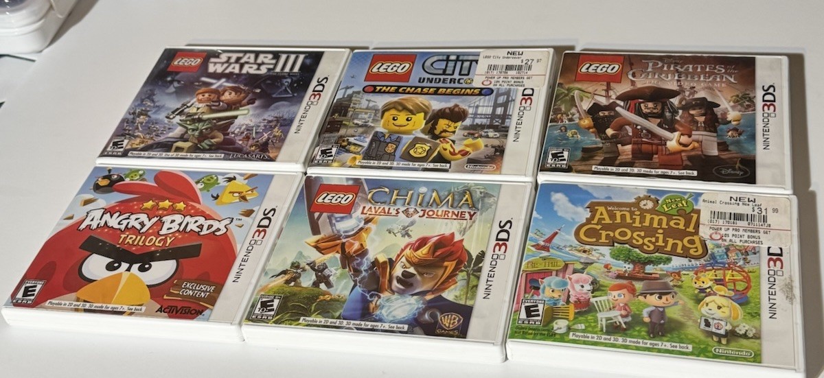 NINETENDO 3DS XL CONSOLE WITH 15 GAMES IN CASES & MANUALS 9 GAMES NO CASES