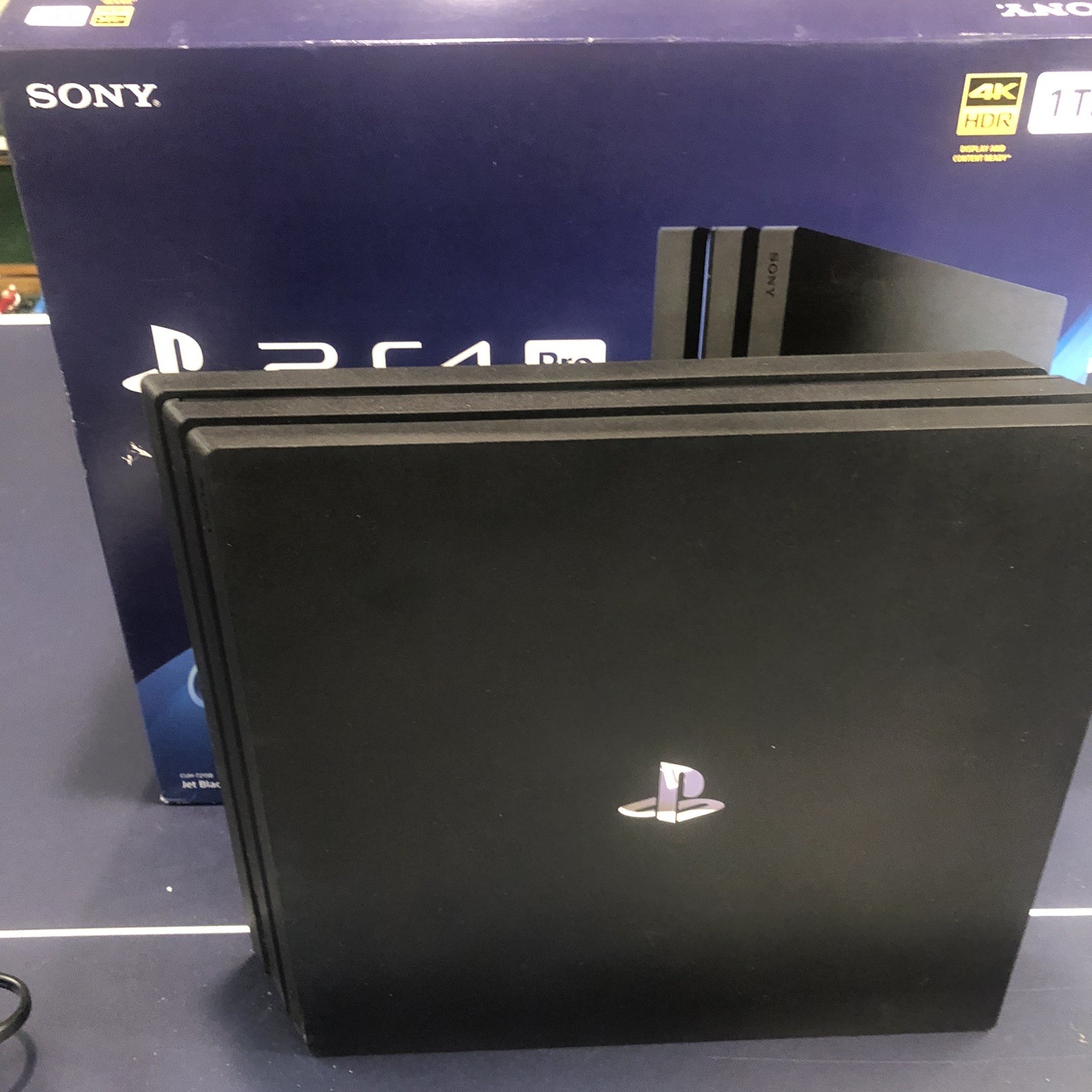 SONY PS4 4K HDR 1 TB – Includes 2 Controllers & 15 Classic Games