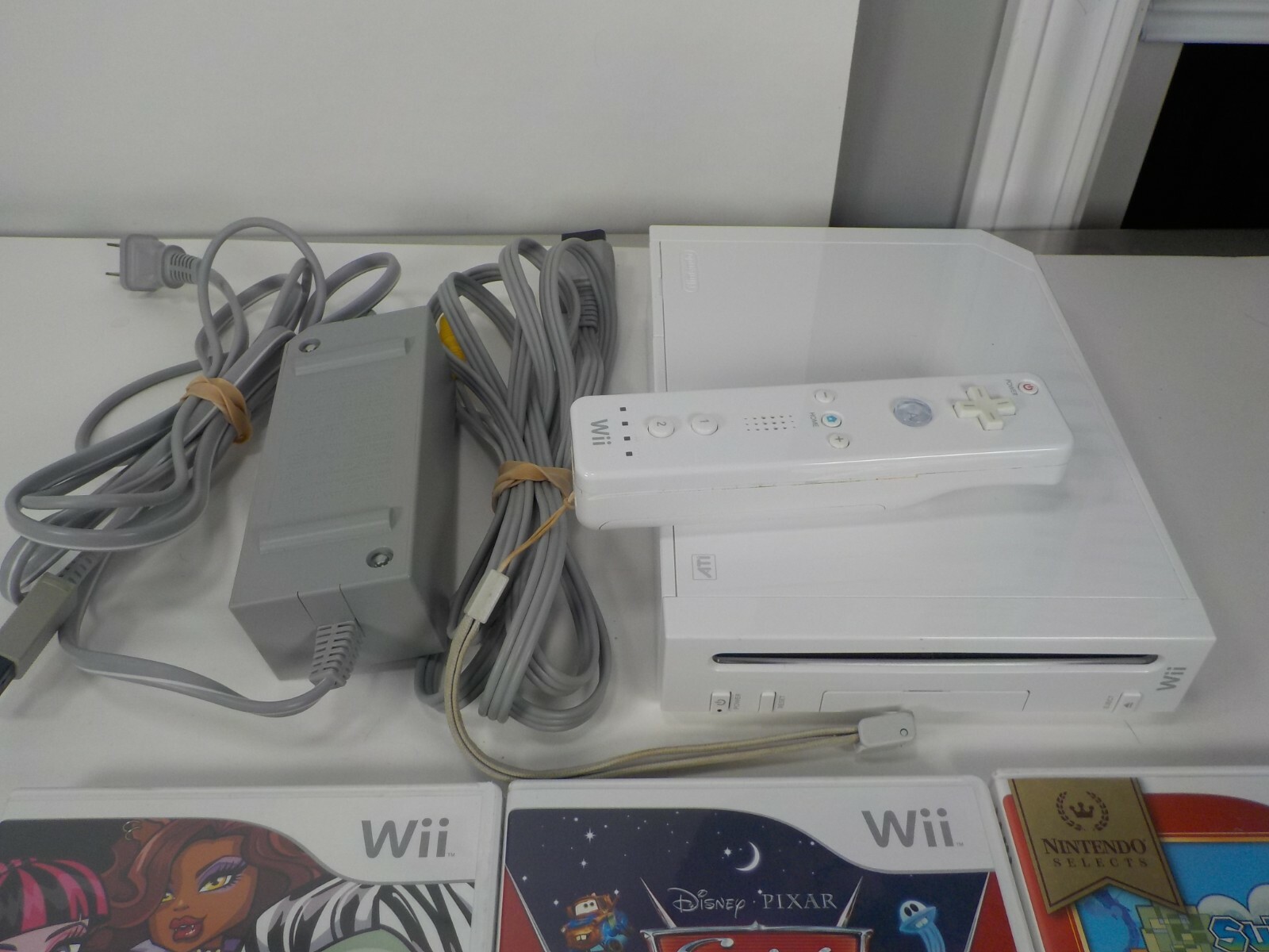 Nintendo Wii RVL-101 Console System Bundle -Remote w/ Mario ,Monster High, Cars