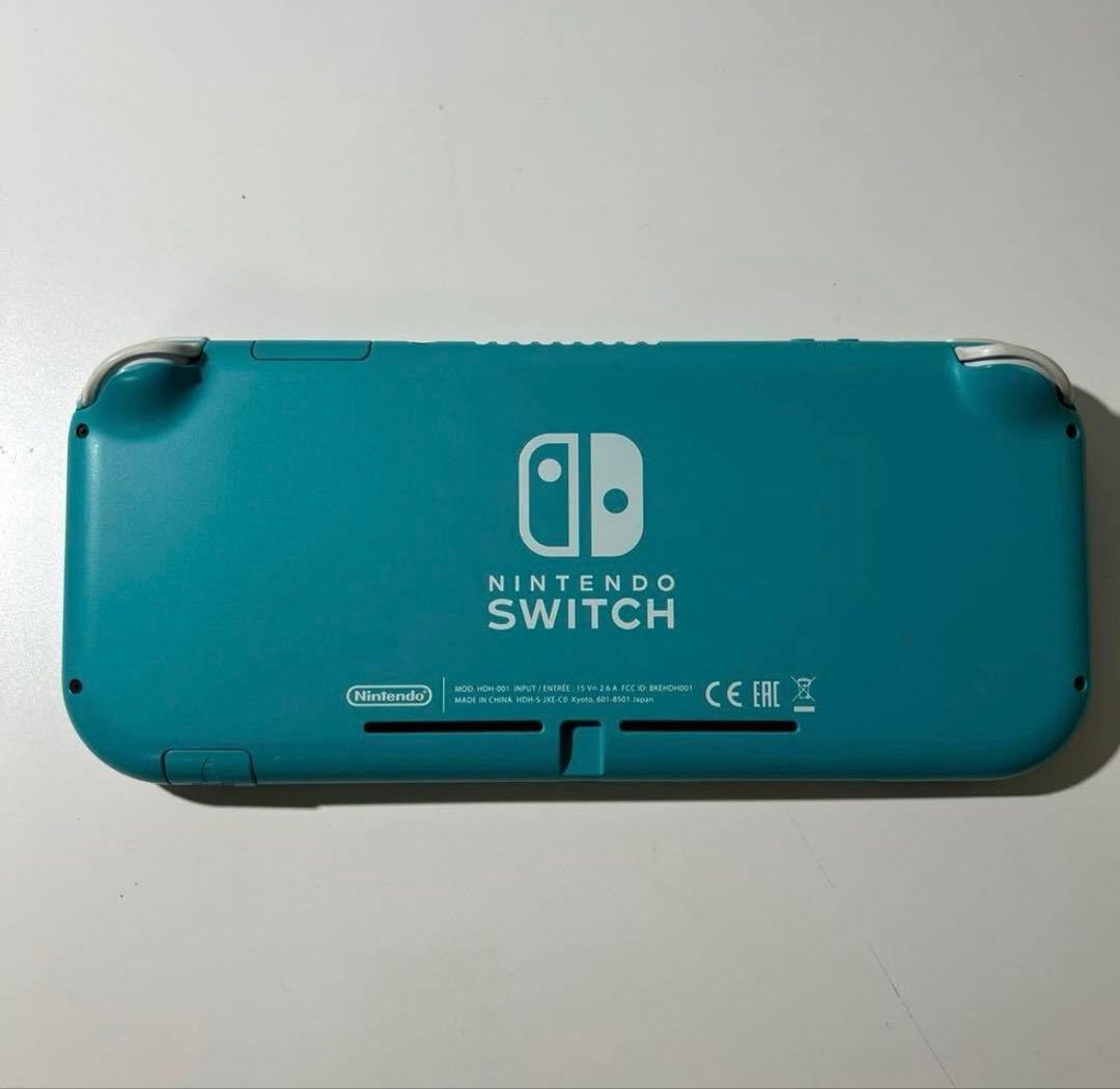 Nintendo Switch Lite Turquoise console with charger light blue