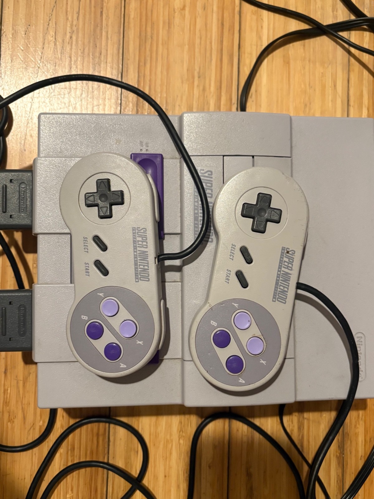 Super Nintendo Console with box and two games, two controllers & manual