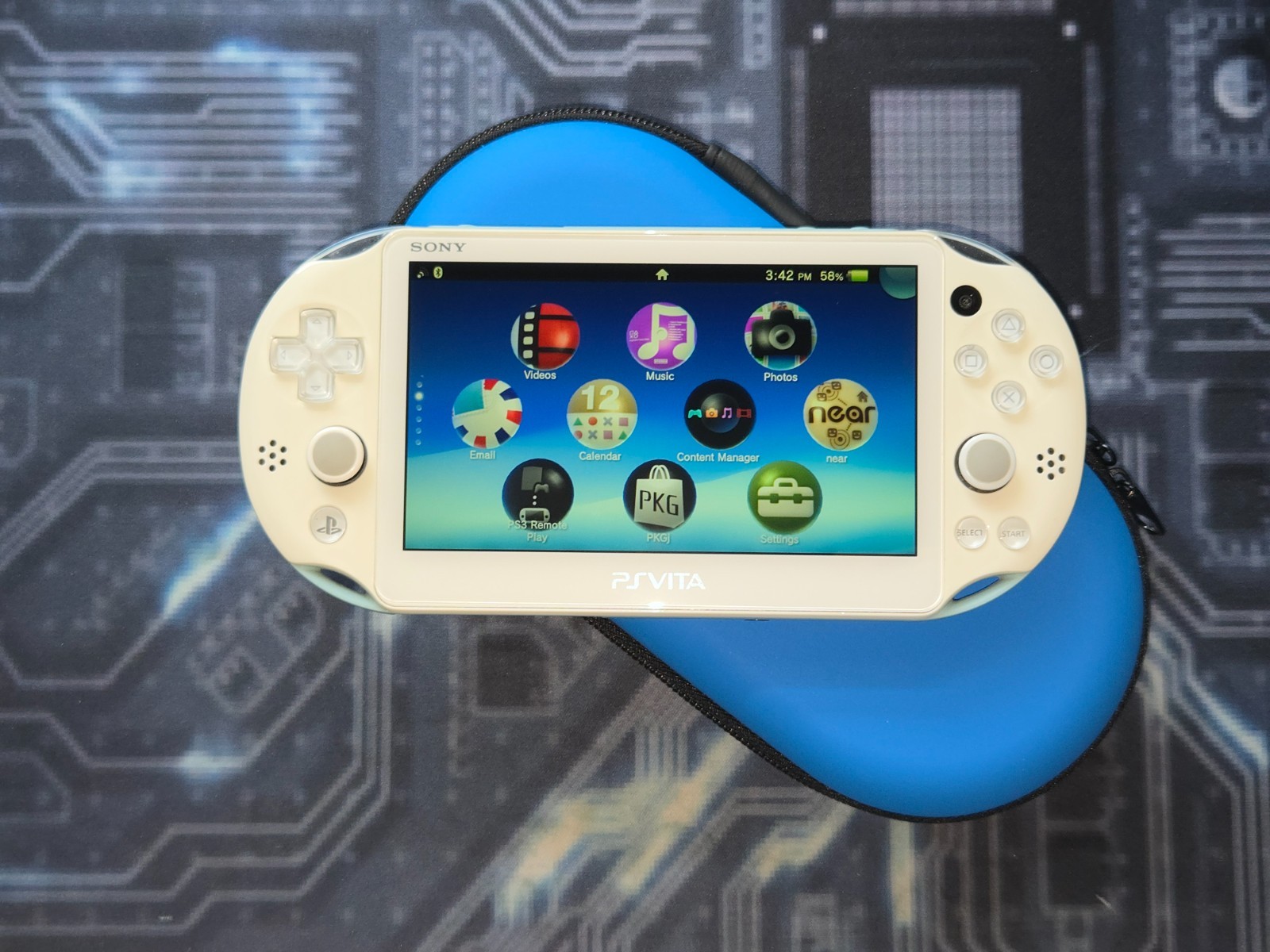 Light Blue/White Sony PlayStation PS Vita 2000 Slim – Handheld Console + Case