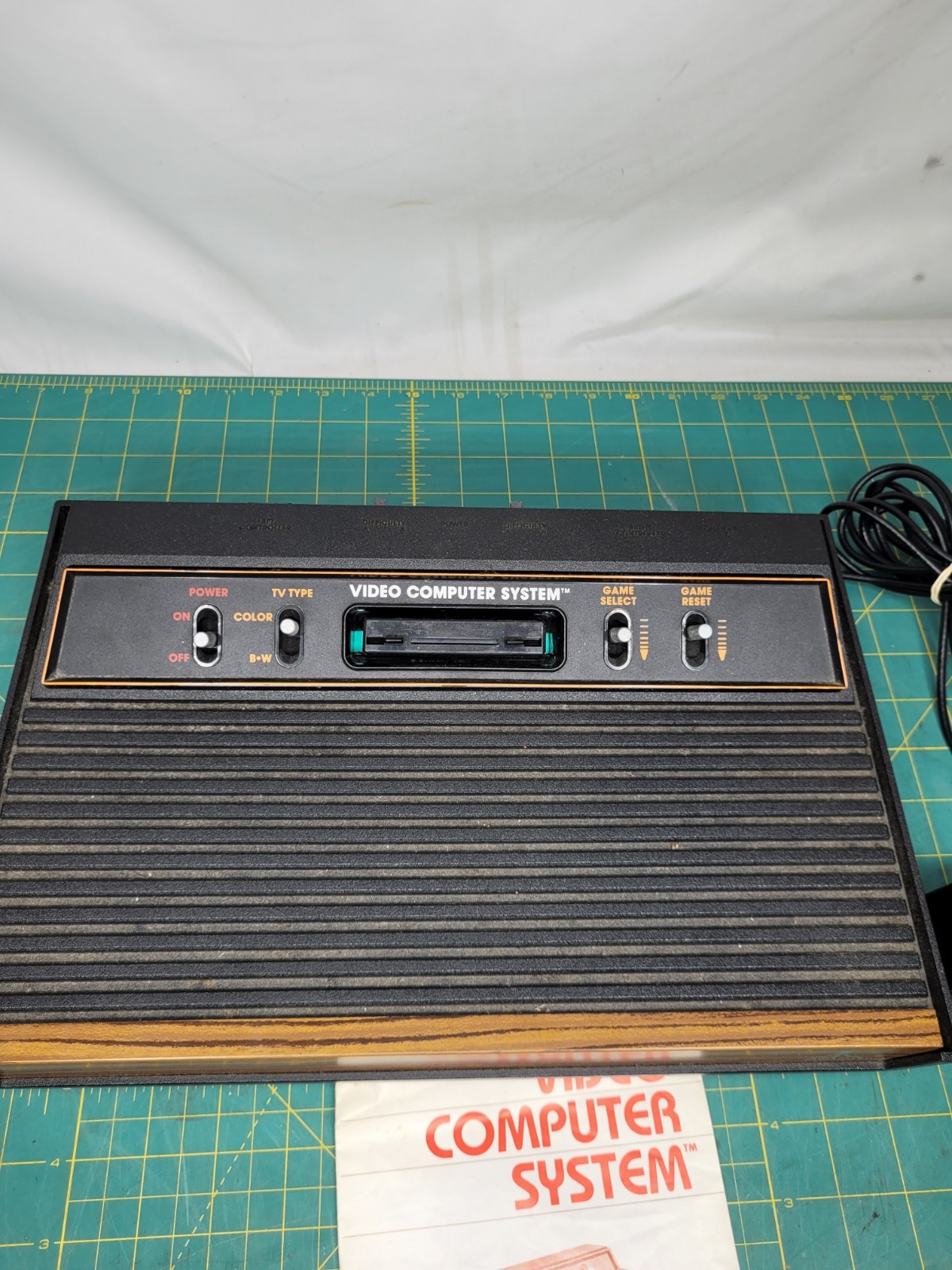 Atari 2600 console With Cords And 4 Joystick Controllers Powers On Needs Work