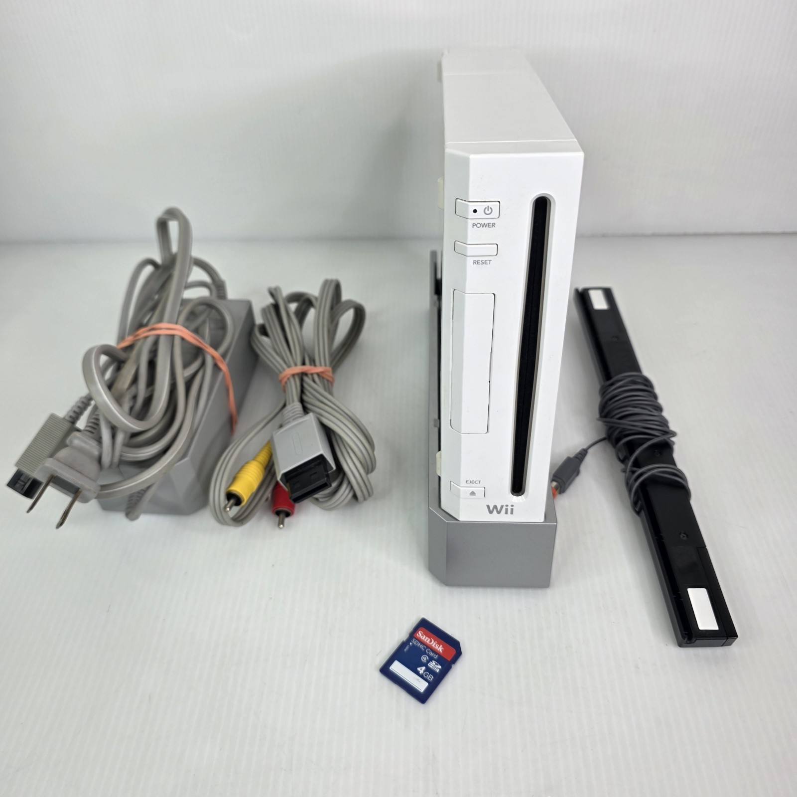 Nintendo Wii Console w/ OEM Stand, Motion Sensor Bar, Cables, SD Card – Works!