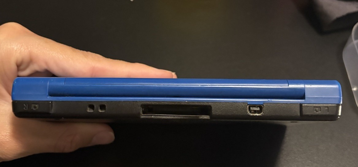 Nintendo DSi XL Midnight w/ USB charger, includes 2 Games, no stylus