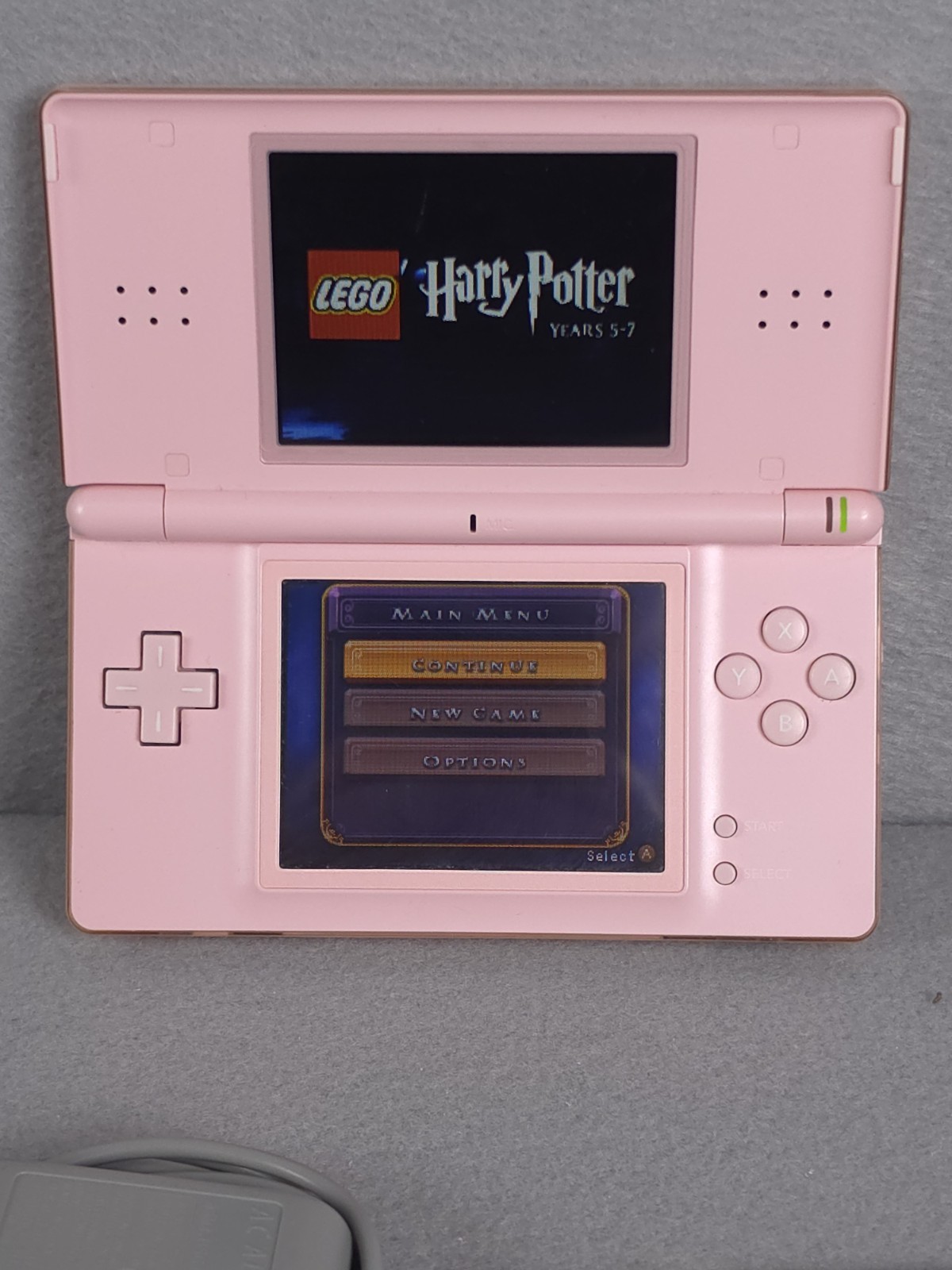 Nintendo DS Lite Console USG-001 with charger – Coral Pink W/6 Games Good Cond.