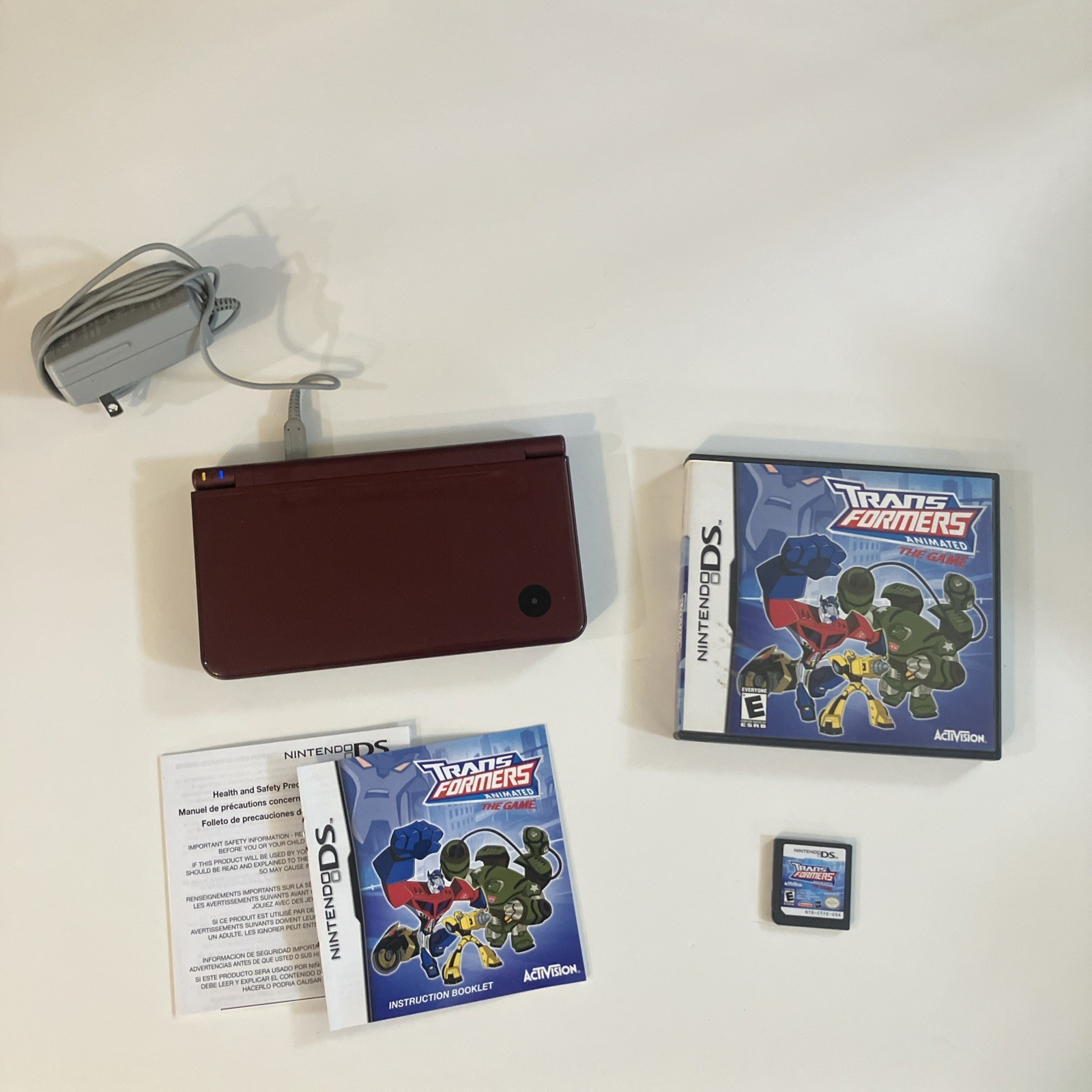 Nintendo DSI XL Handheld console+ Video game transformers +charger red color