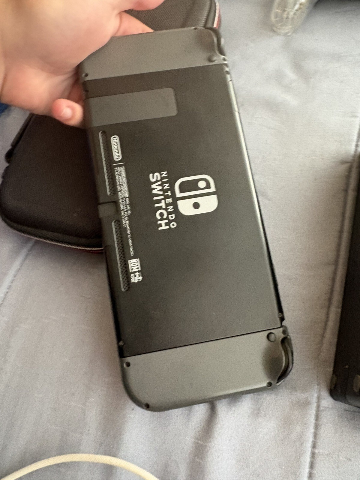 Nintendo Switch Handheld Console Gray Joy-Cons with dock and a case.