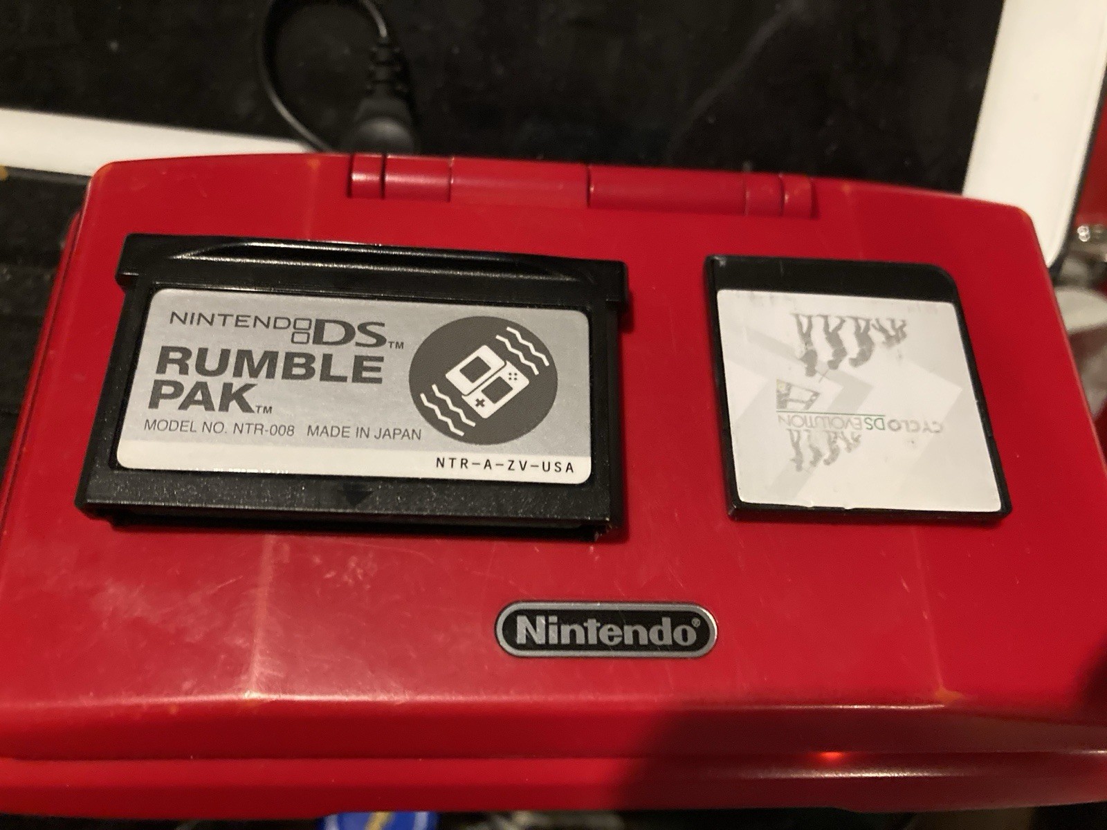 Nintendo DS Red Handheld Dual Screen Console with EVOLUTION MULTI-GAMES ON 2GB