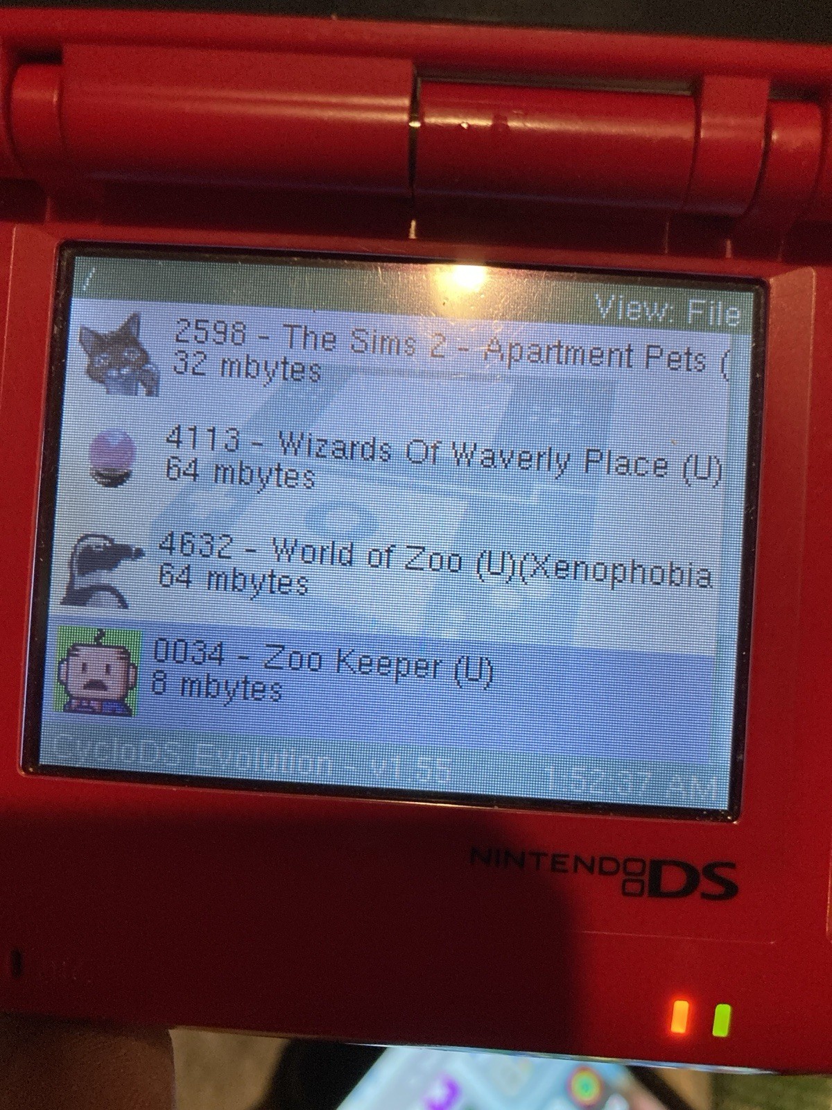 Nintendo DS Red Handheld Dual Screen Console with EVOLUTION MULTI-GAMES ON 2GB