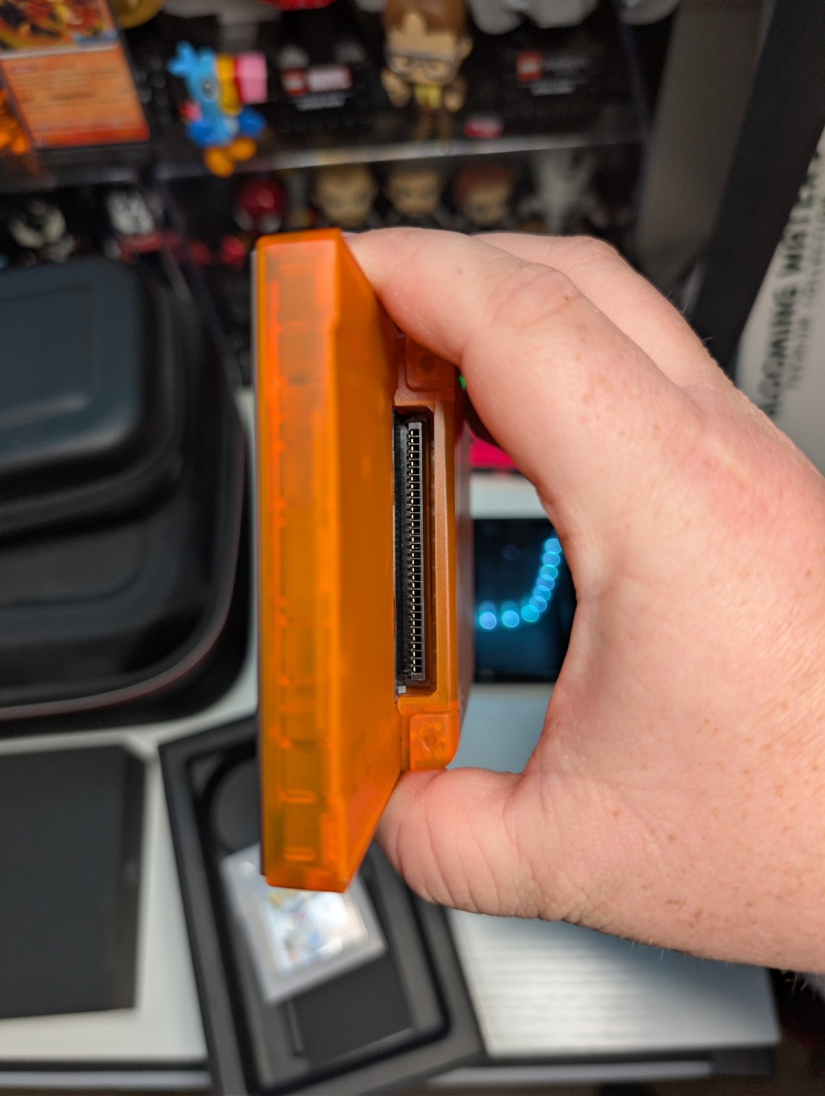 Analogue Pocket Handheld – Transparent Orange Limited Edition w/ pokemon silver