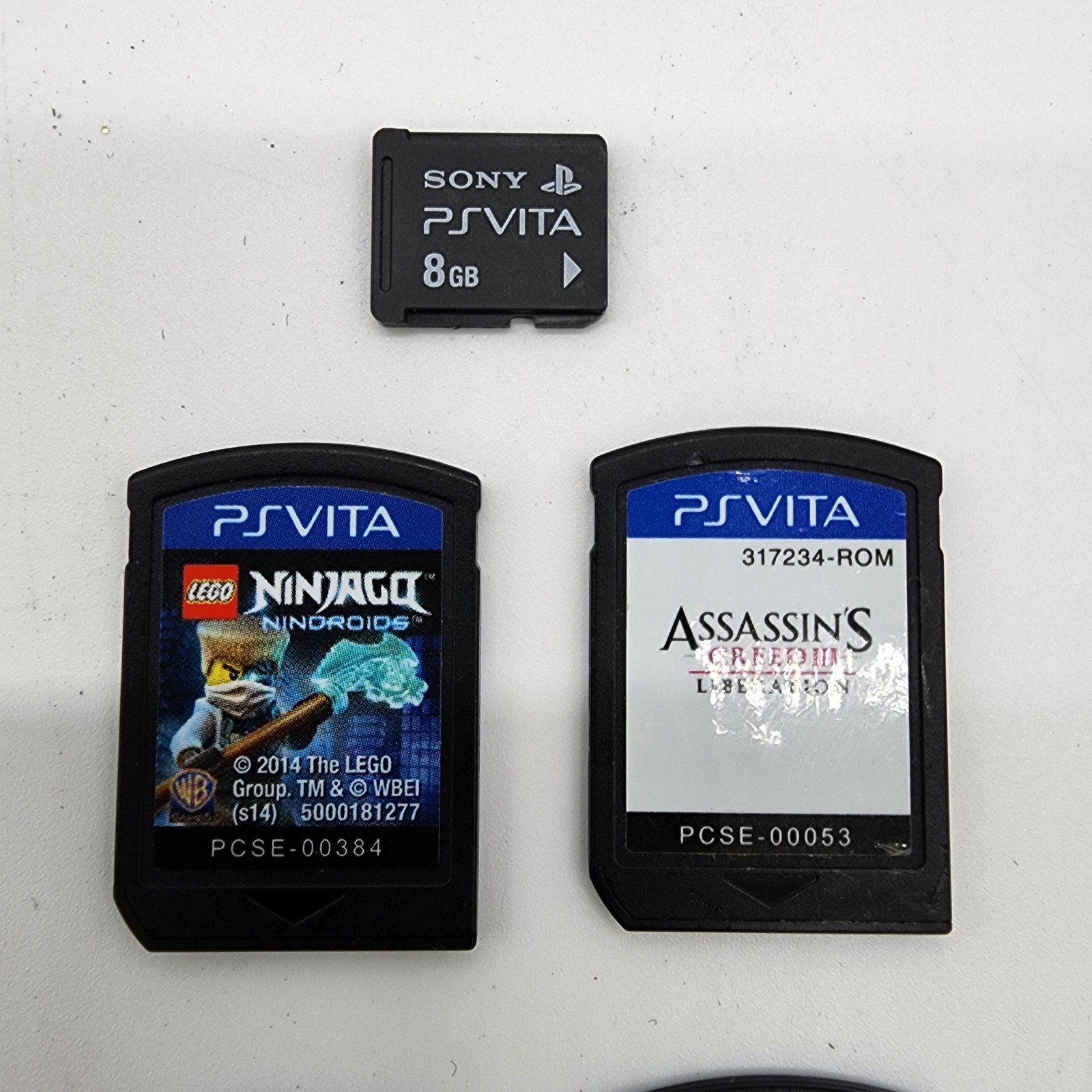 PlayStation PS Vita PCH-1001 Bundle – 5 Games, Memory Card, 8 GB Charger