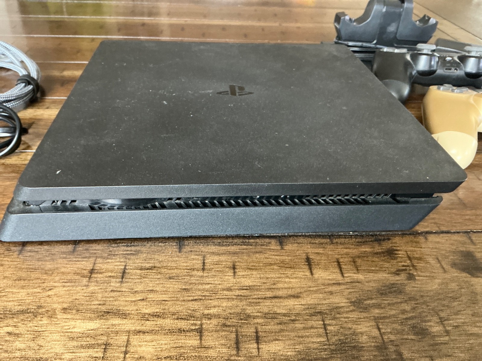 Sony PlayStation 4 Slim Console, two Controllers, Controller Dock and cables