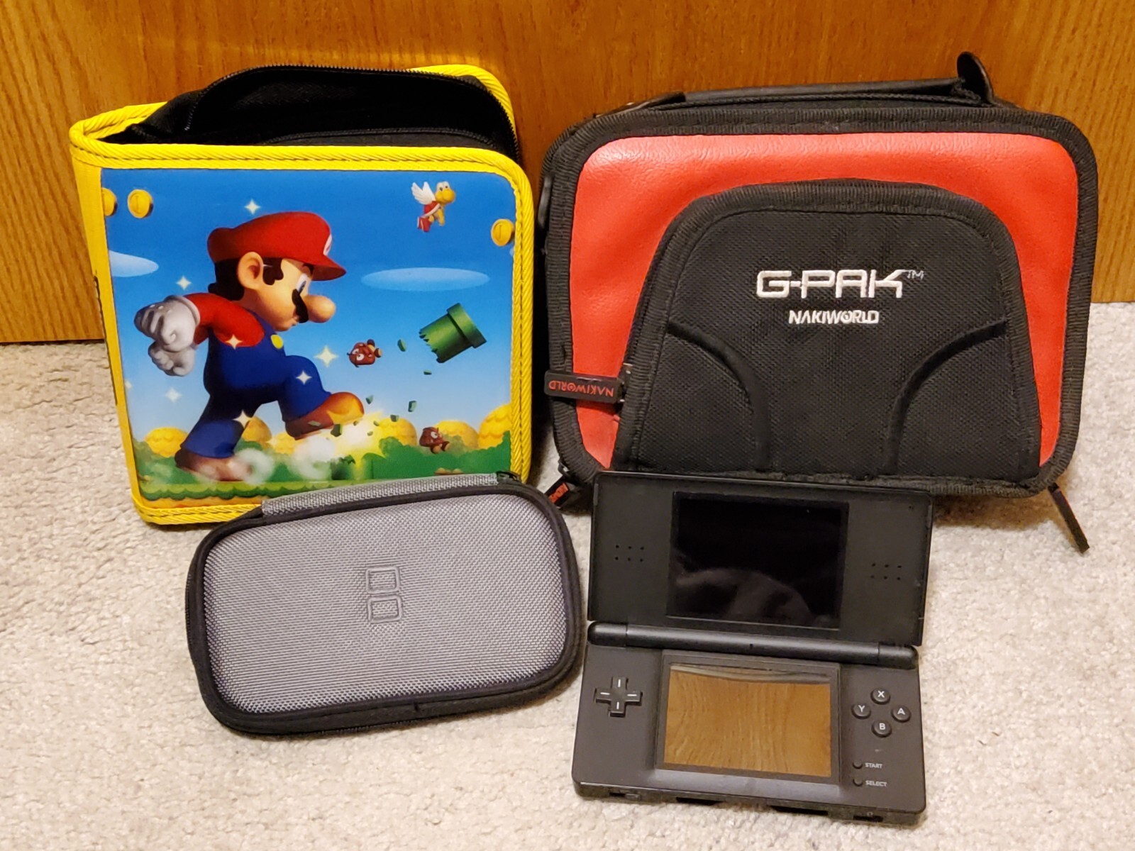 Nintendo DS Lite Black Bundle w/ Charger, Mario, G-Pak, Gamer Cases, 8 games
