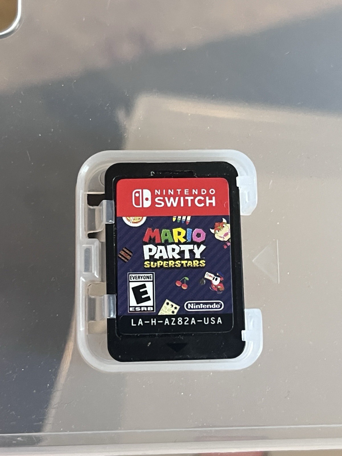 Nintendo Switch White Joy-Con Controller, Charger, With Three Mario Game Bundle