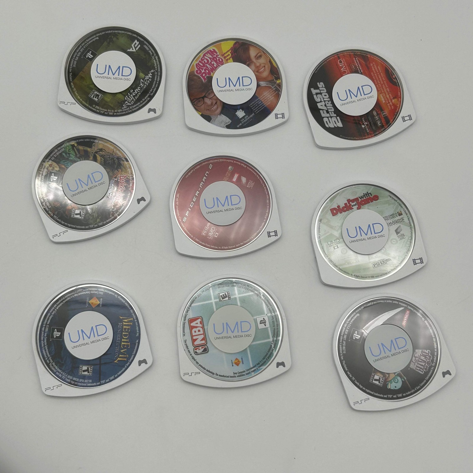 Sony PSP 1001 – 9 Game Bundle | Logitech Amp | Tested / Needs Battery – Used