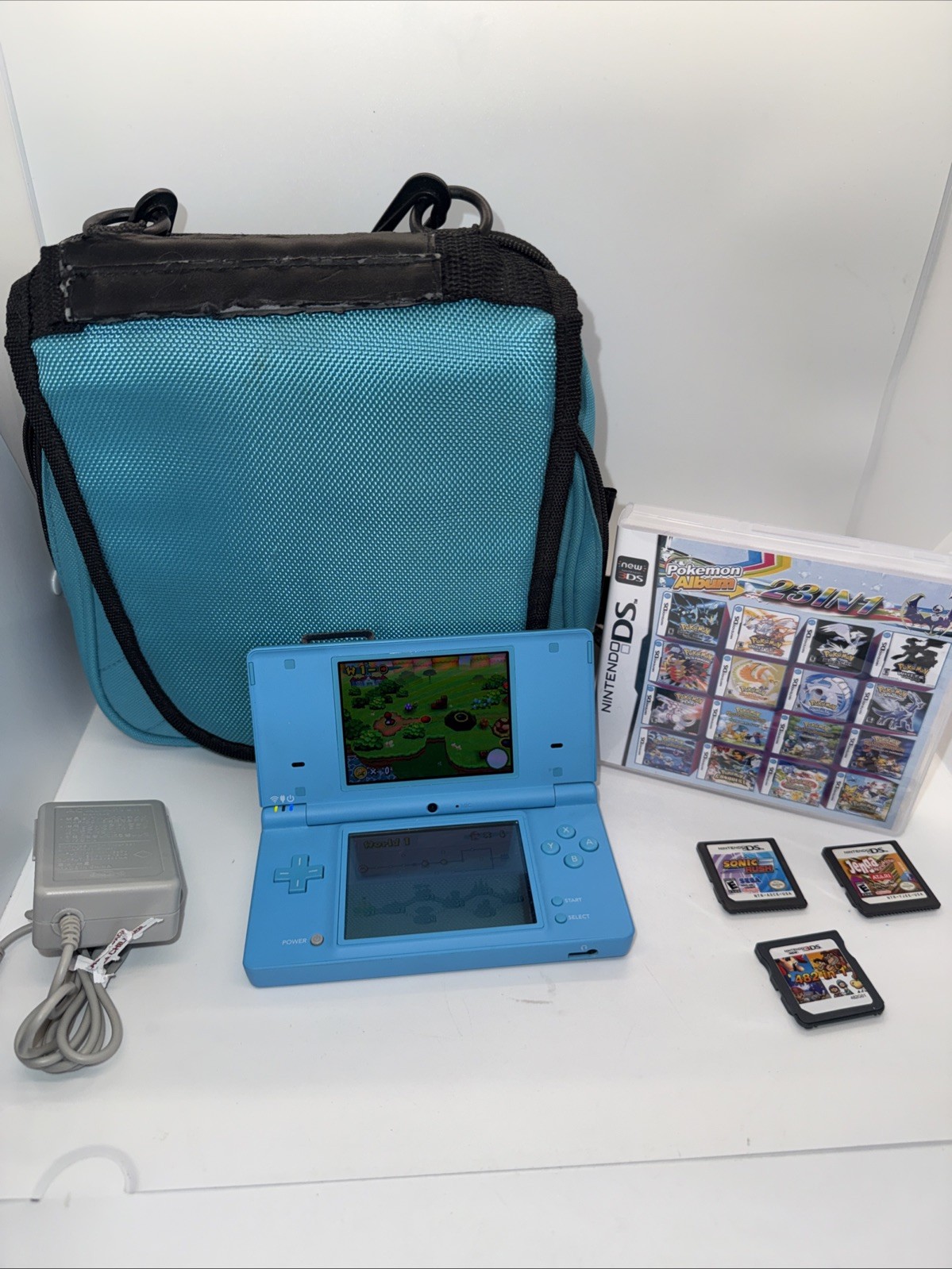 Nintendo Dsi Teal Light Blue Case Charger 4 Games Pokemon Album 23 In 1