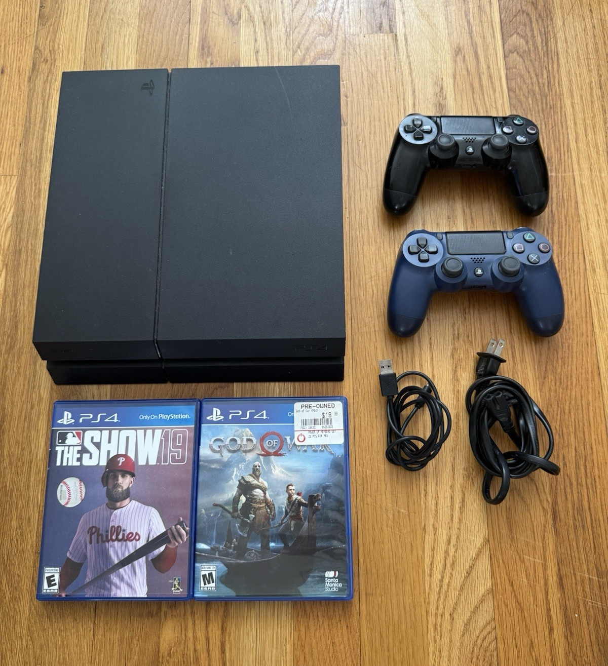 PS4 with two controllers and two games