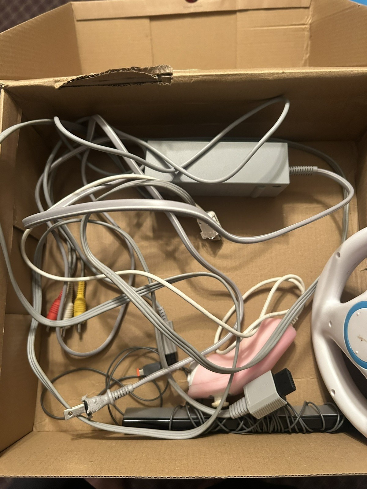 Nintendo Wii Tested And Working. Includes cables and everything pictured.