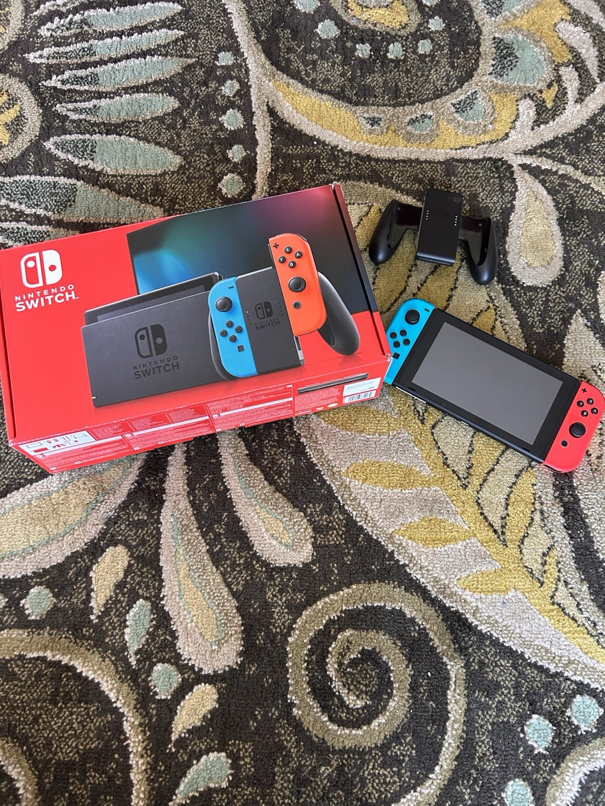 Nintendo Switch with everything still included works perfectly fine.