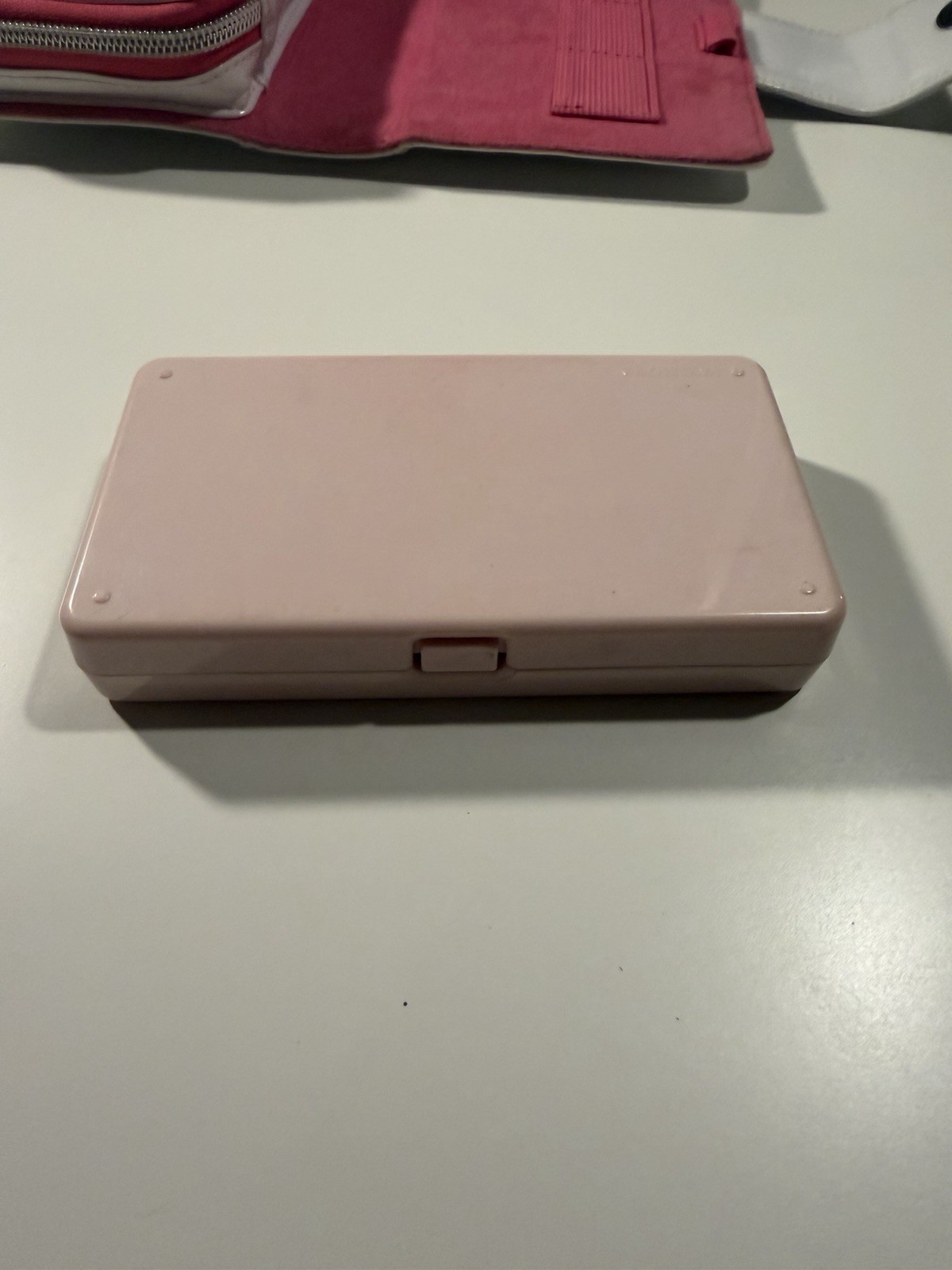 Nintendo DS Lite Metallic Rose System With Charger, Original Box, And 2 Cases