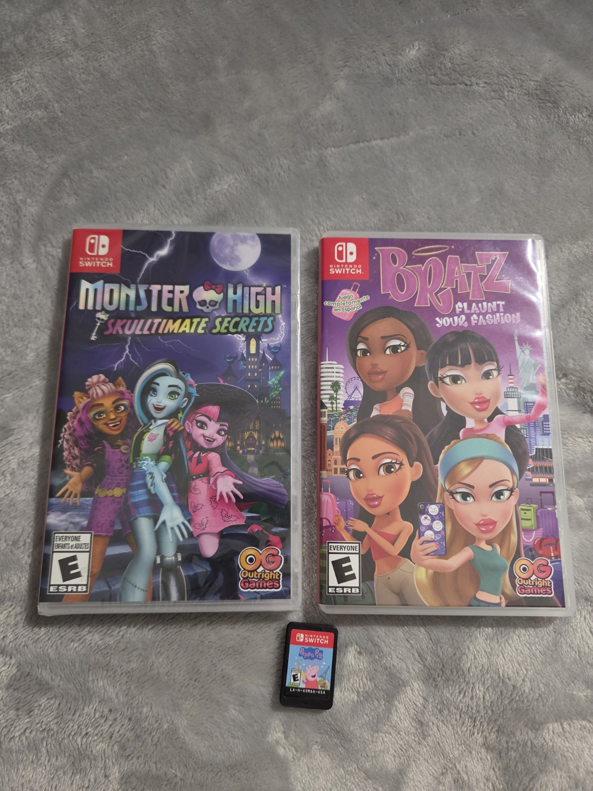 Nintendo Switch Lite Coral with Bratz, Monster High, & Peppa Pig Games, Charger