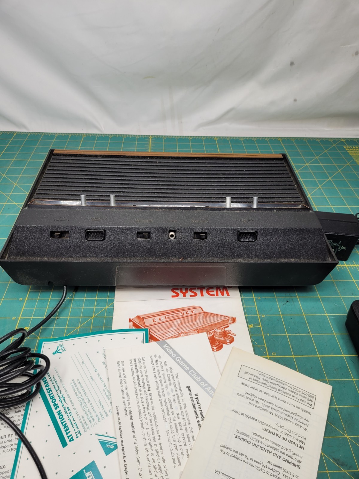 Atari 2600 console With Cords And 4 Joystick Controllers Powers On Needs Work