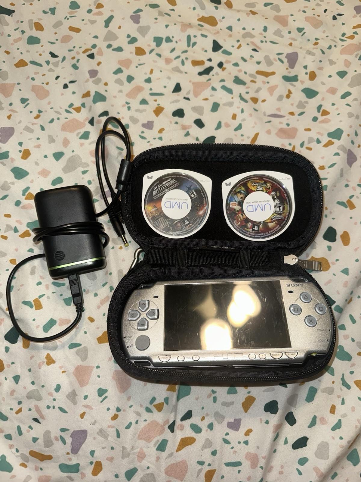 PSP 2001 Silver CONSOLE W/2 Games And Charger Tested
