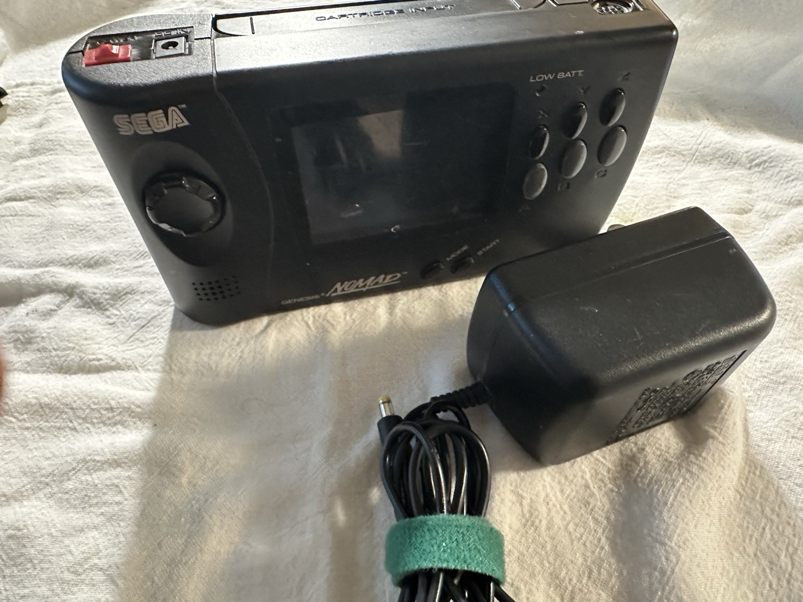 SEGA Genesis Nomad MK-6100 Handheld System W/ power supply. Tested runs great.