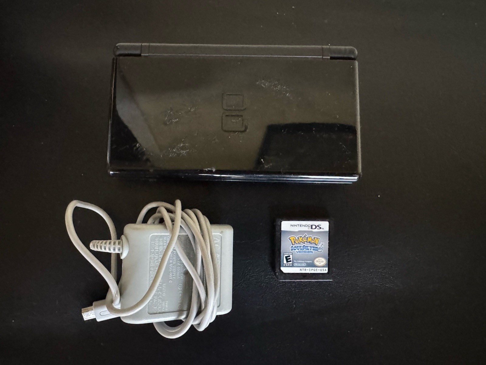 Nintendo DS Lite Handheld System – Black w/Stylus, Charger, & Pokemon SoulSilver