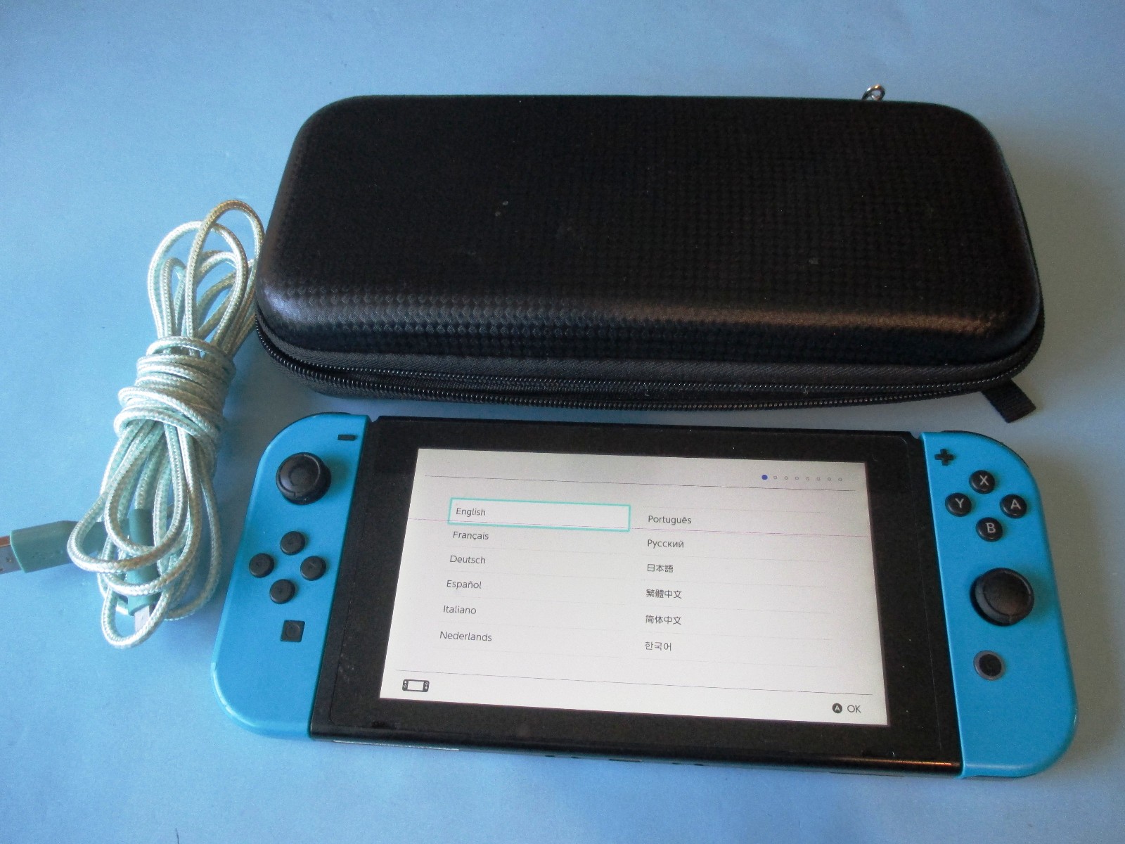 Nintendo Switch System Console w/Neon Blue Joy-Cons + Case & Charger