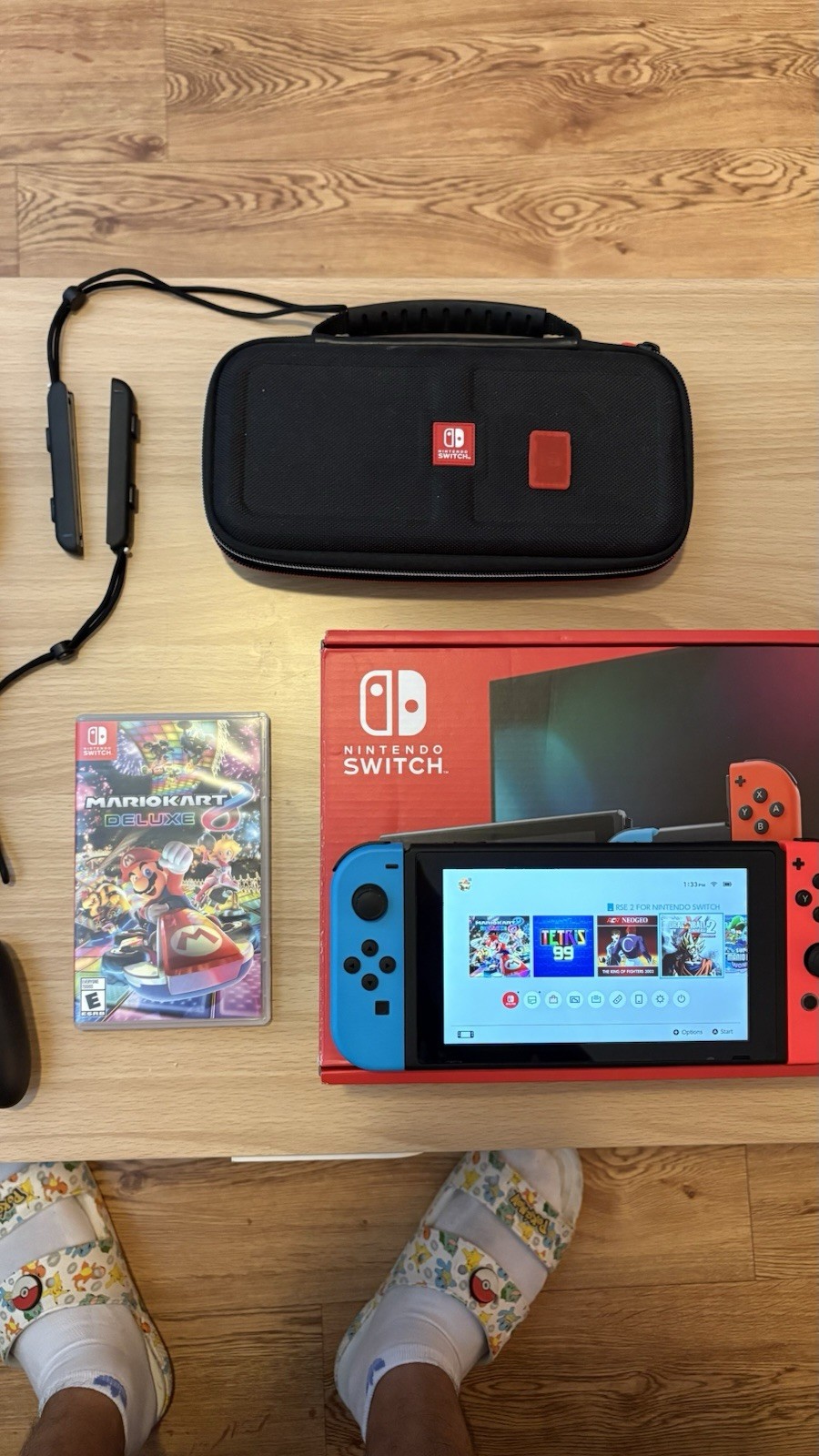 Nintendo Switch with Blue and Red Joy-Con Controllers and Mario Kart 8 – Black