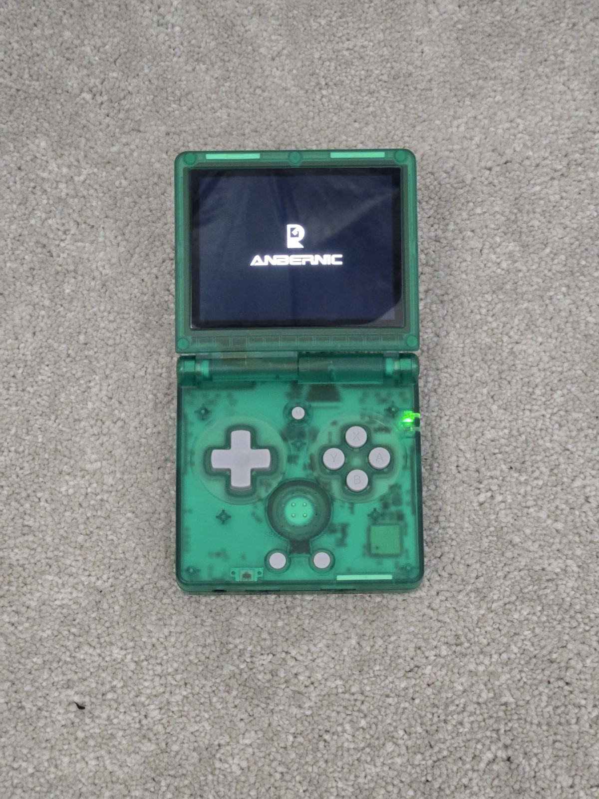Anbernic game console RG35XXSP retro handheld transparent green tested arcade