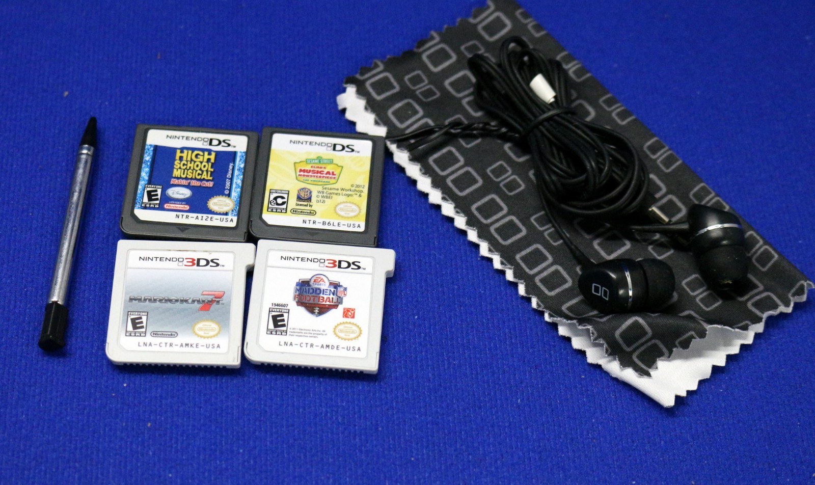 Nintendo 3DS Cosmo Black Console Case, Earbuds, 1 stylus, Charger + 4 Games
