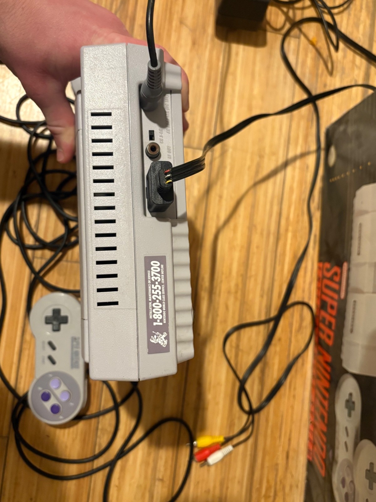 Super Nintendo Console with box and two games, two controllers & manual