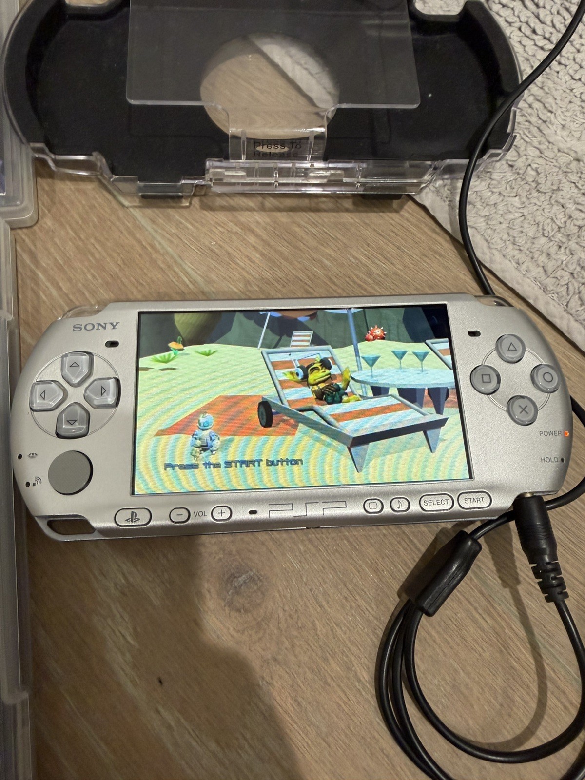 Sony PSP 3001 US Handheld Silver Console with games and case