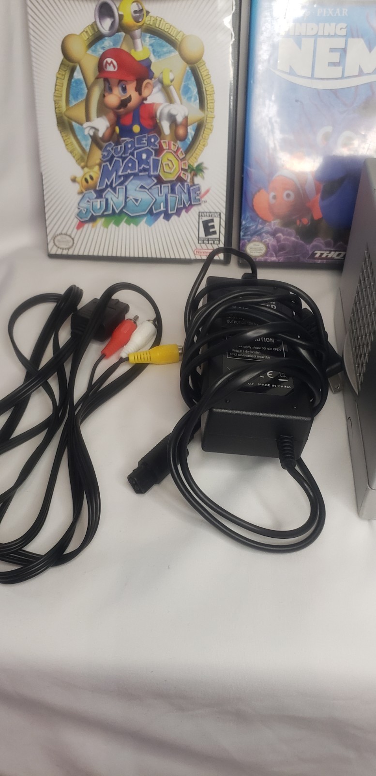 GameCube with 3 remotes, 2 games, cords, and remotes!