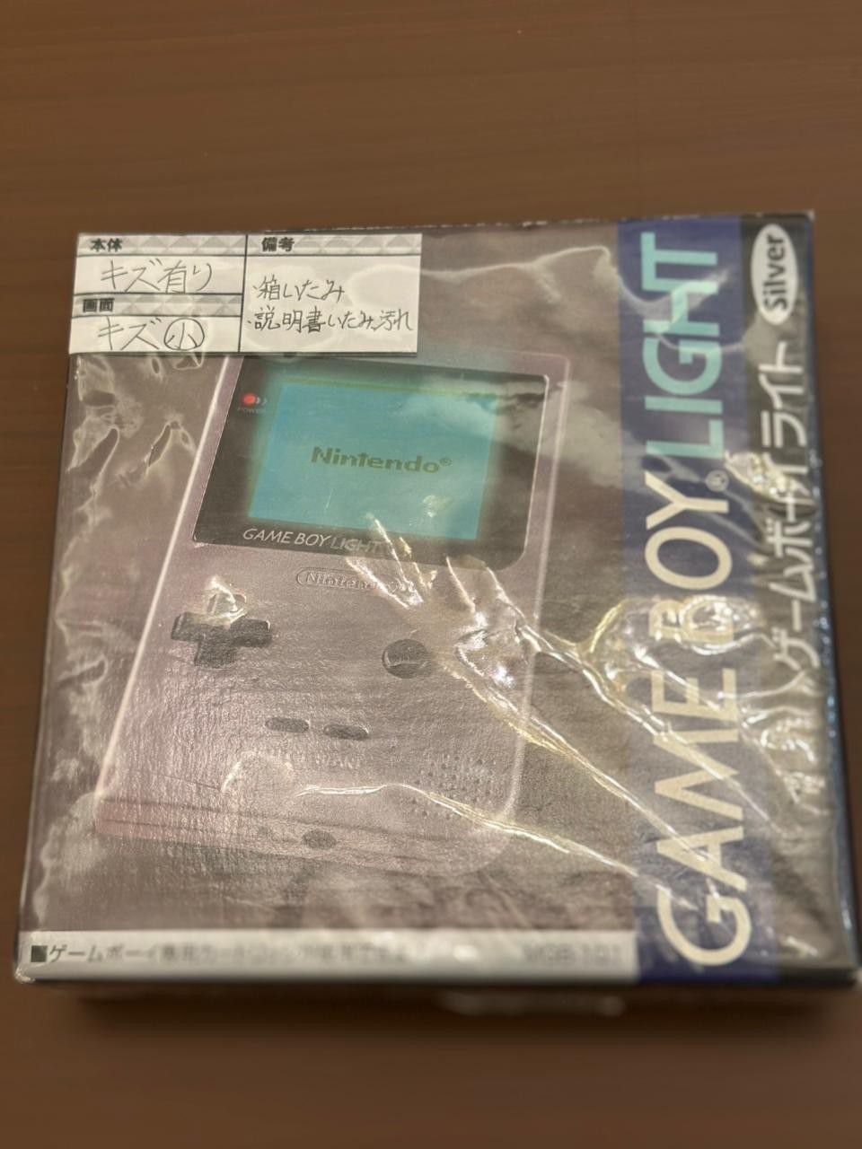 Nintendo Game Boy Light Launch Edition Silver , Sealed . with old invoice