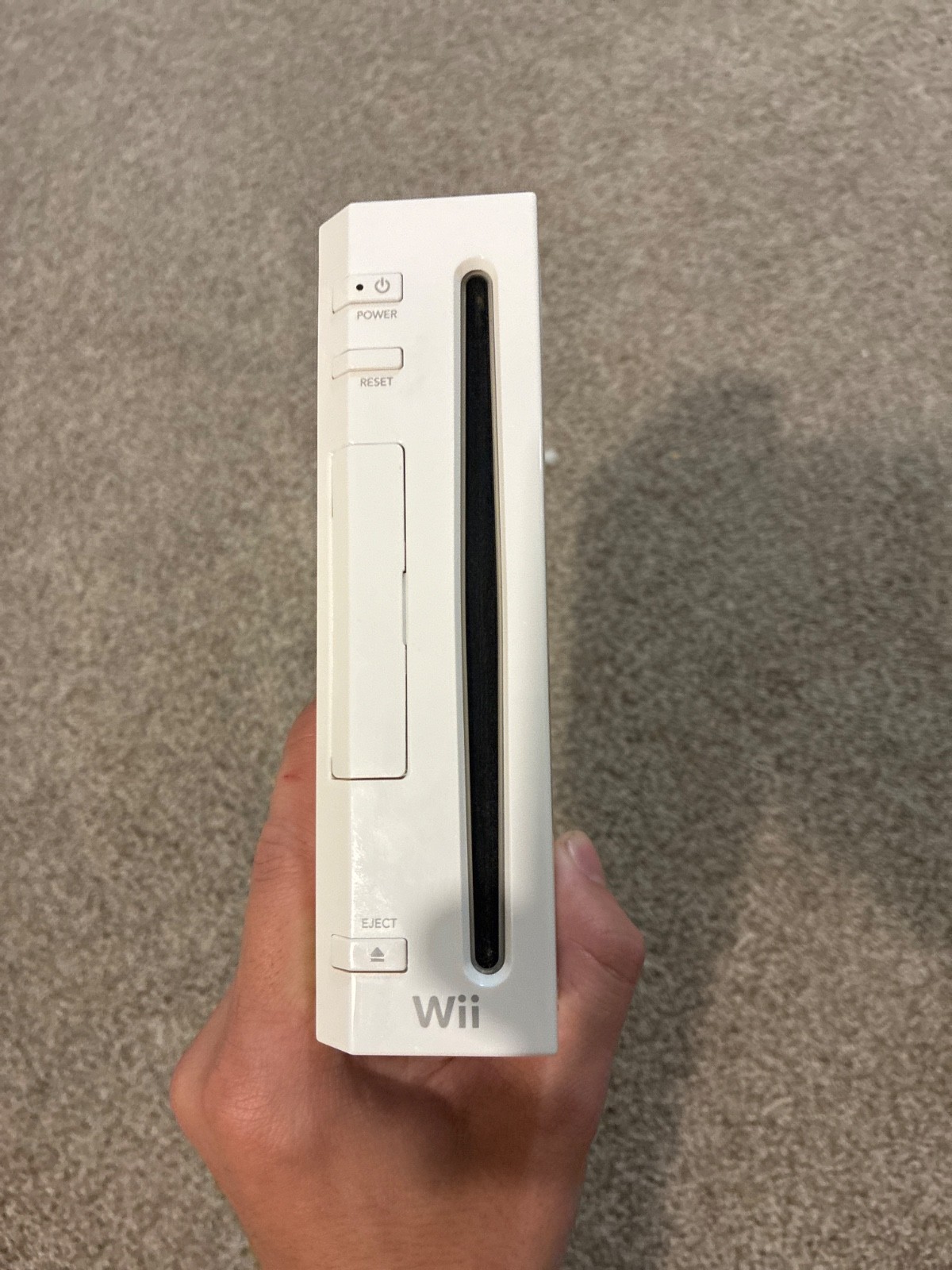 Nintendo Wii console, three controllers, four nunchucks, Wii steering wheel