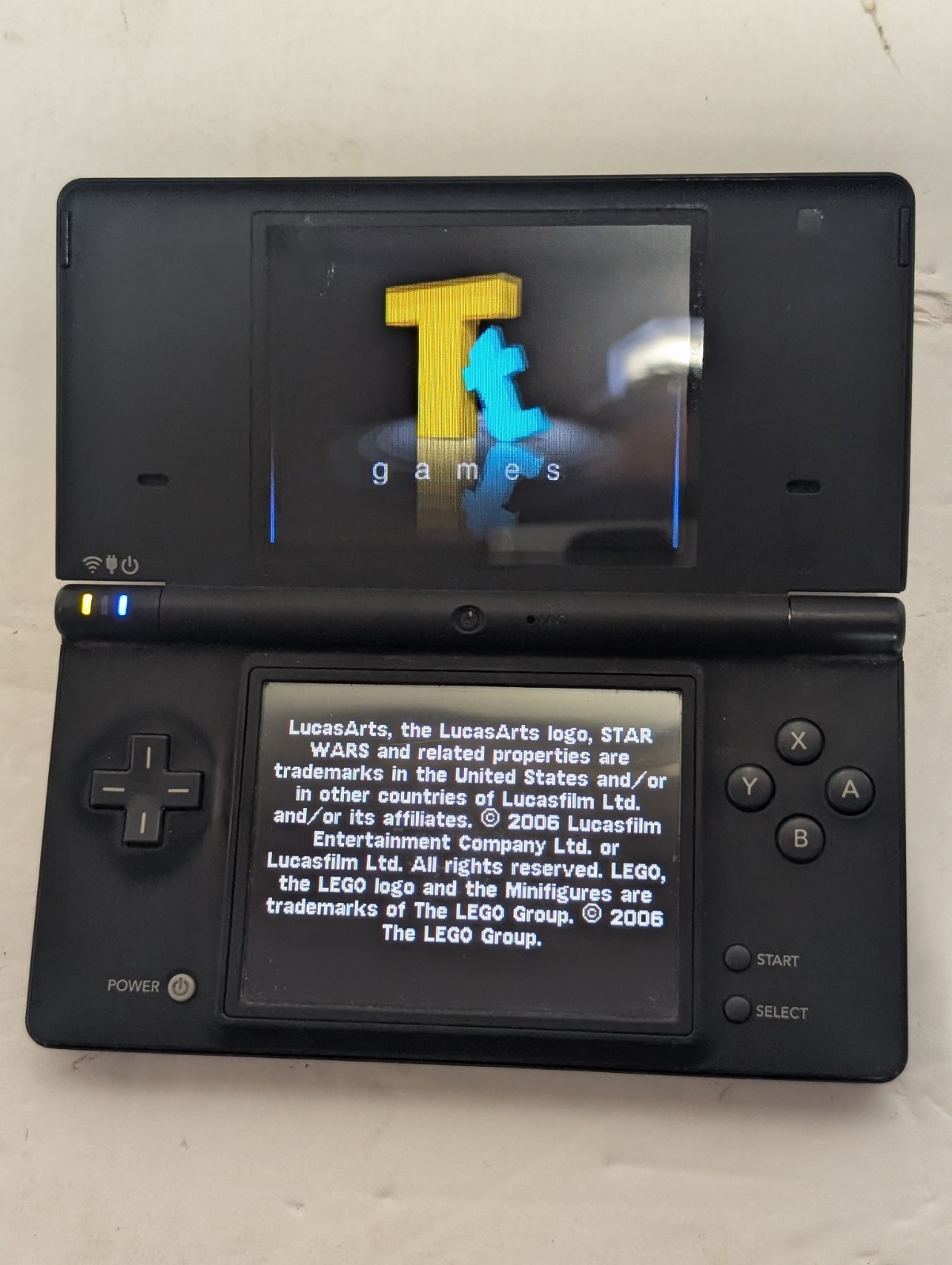 Nintendo DSi Black Console + Charger + Stylus + LEGO Star Wars II–Tested Working