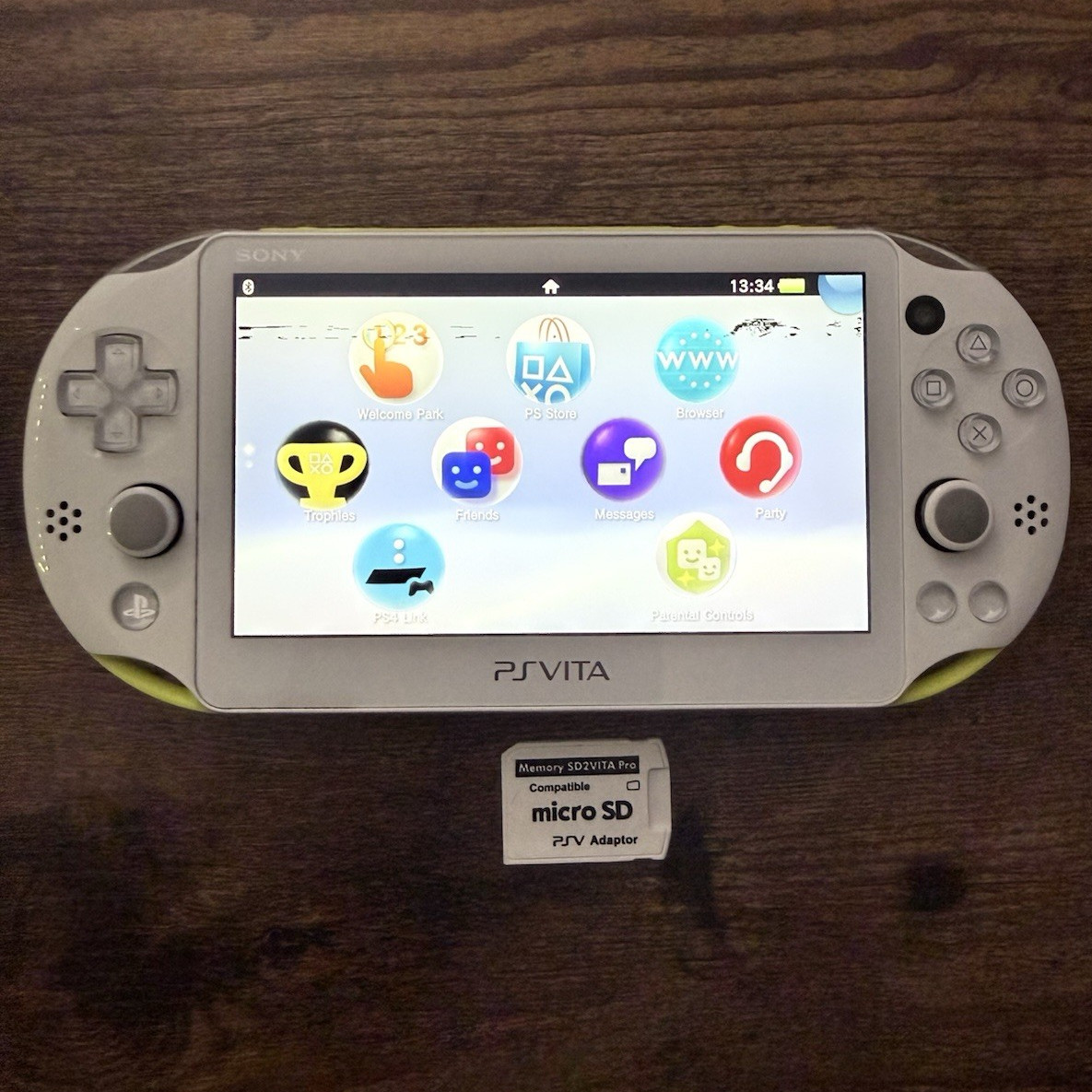Sony PS Vita 2000 Handheld Console White/Yellow with Wi-Fi micro SD Adapter
