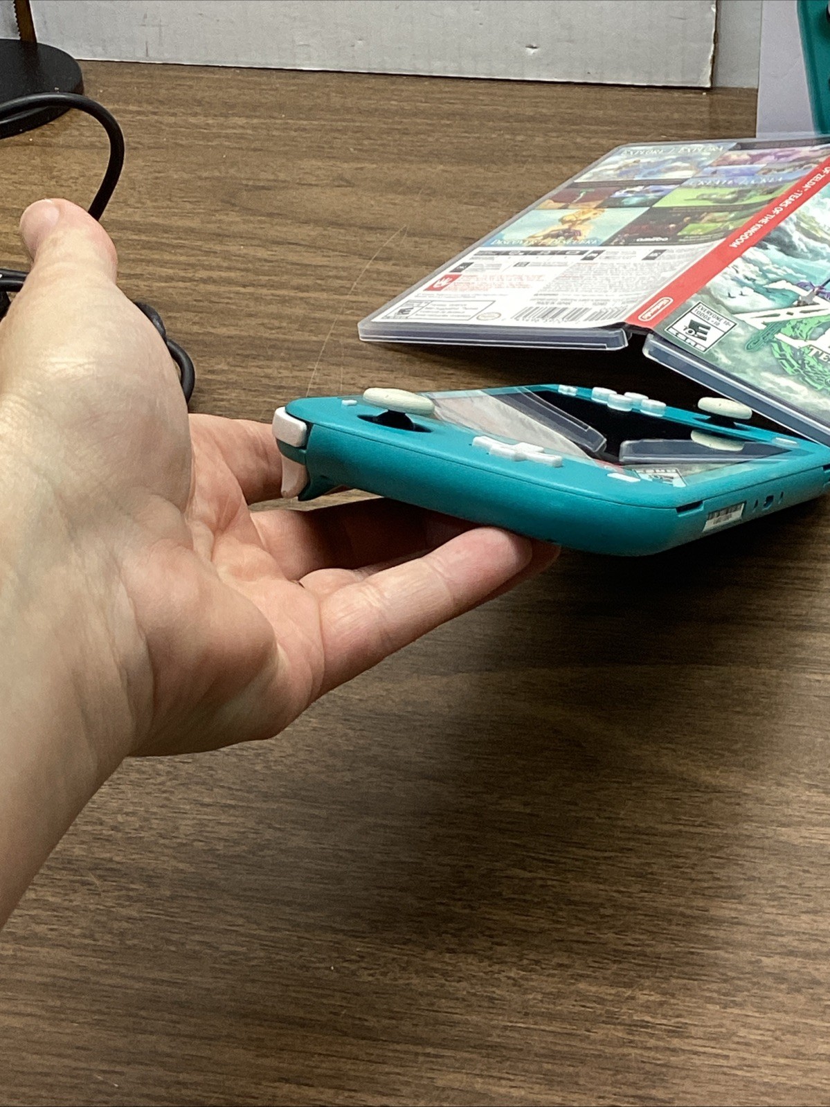 Nintendo Switch Lite Turquoise Teal Handheld Console Bundle with Zelda Game
