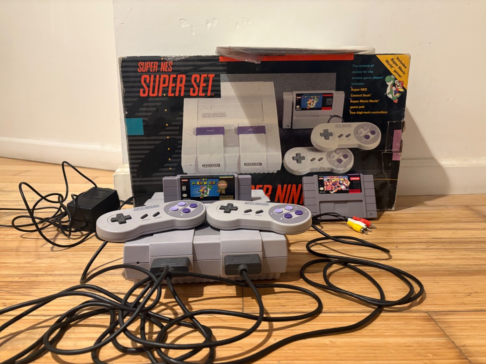 Super Nintendo Console with box and two games, two controllers & manual