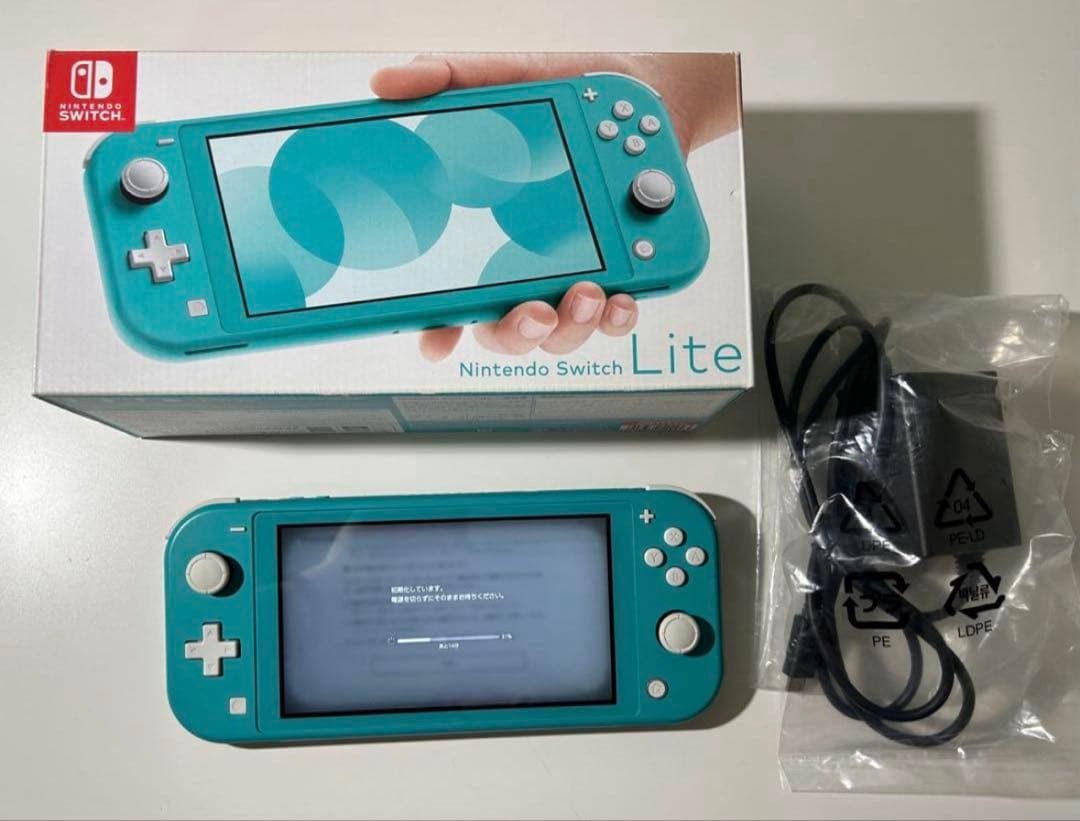 Nintendo Switch Lite Turquoise console with charger light blue