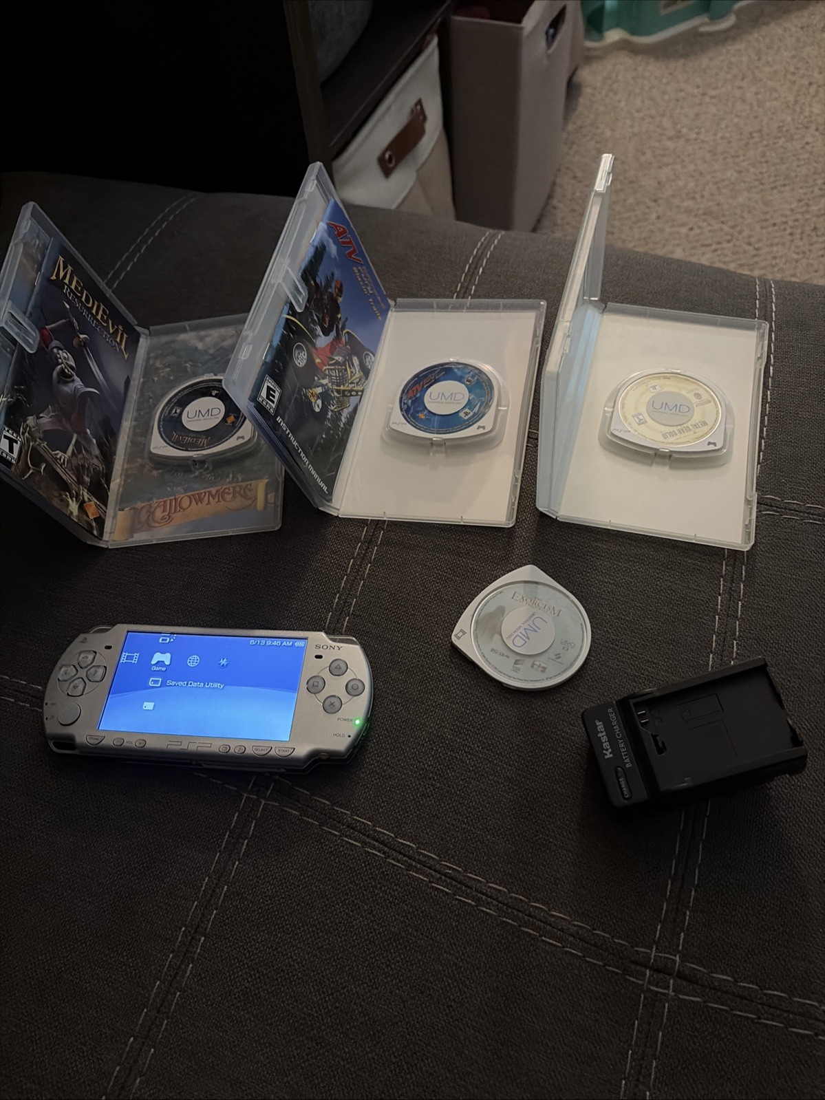 Sony PSP 2001 Handheld Console System Silver with 3 games and 1 movie.