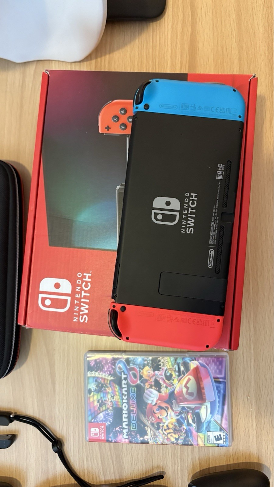Nintendo Switch with Blue and Red Joy-Con Controllers and Mario Kart 8 – Black