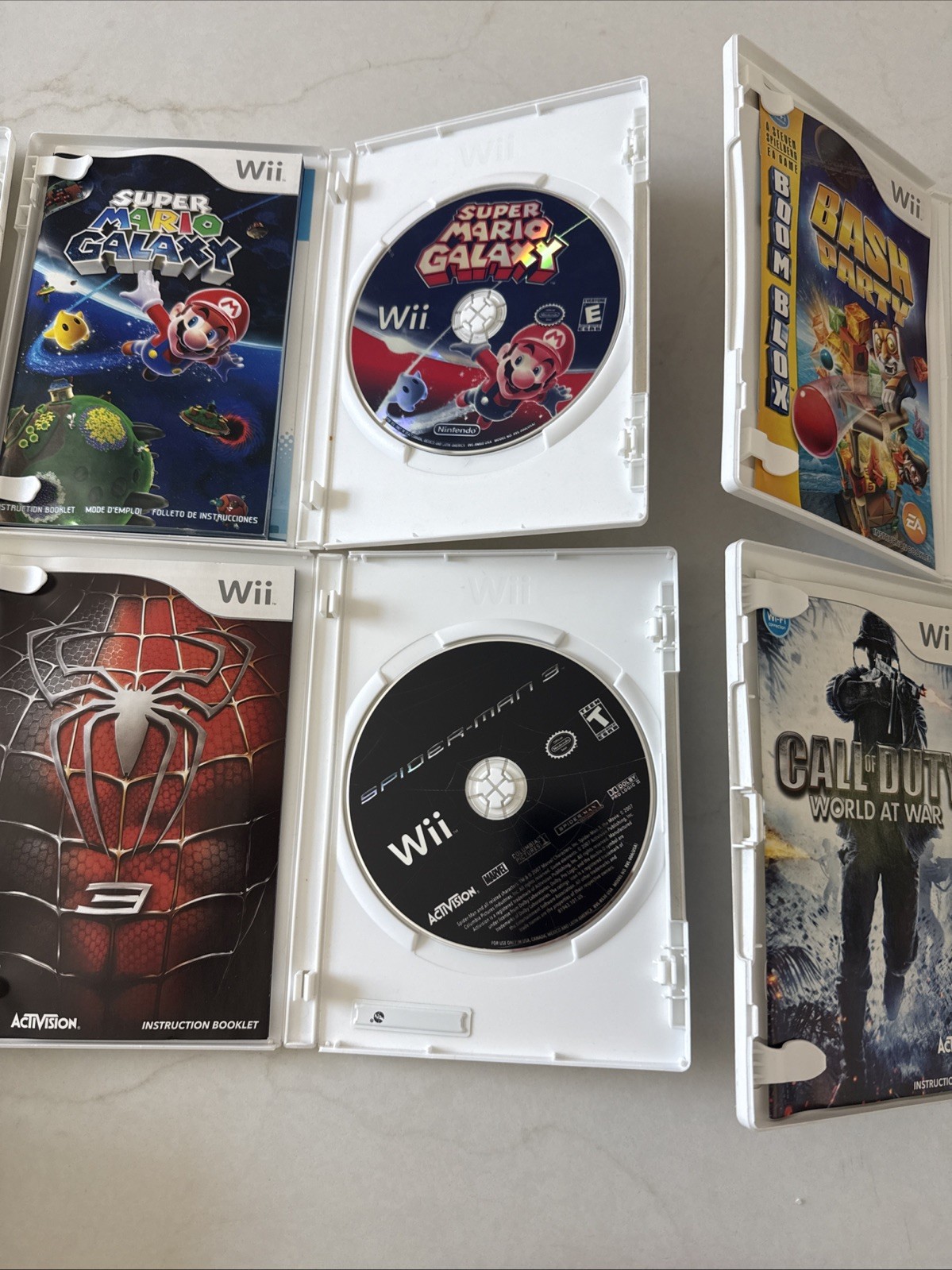 Nintendo Wii Bundle 7 Games, 3 Controllers, Nunchucks, Classic Controller Wheel