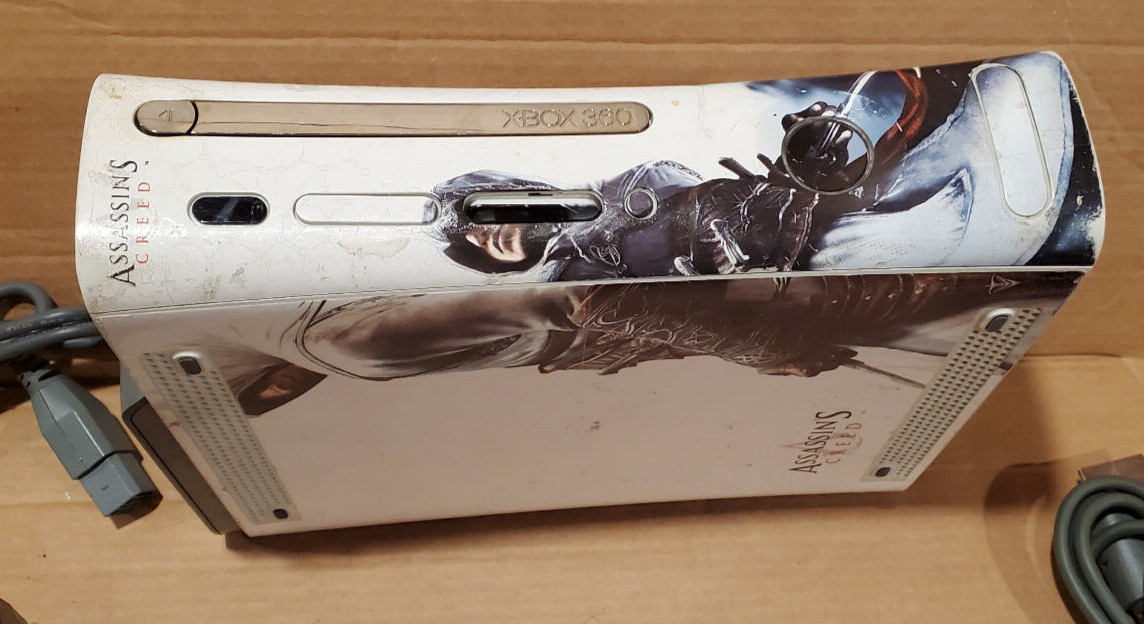 Microsoft Xbox 360 Pro 20GB Video Game Console – White with assassin creed skin