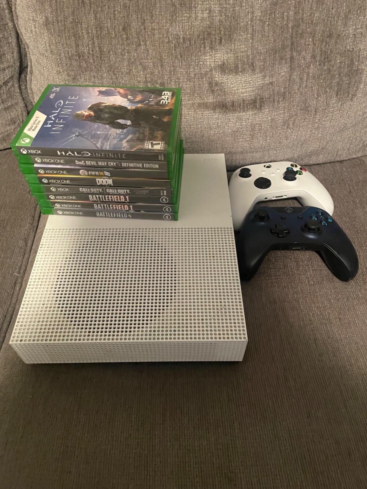 xbox with 2 controllers and 8 games and both wires